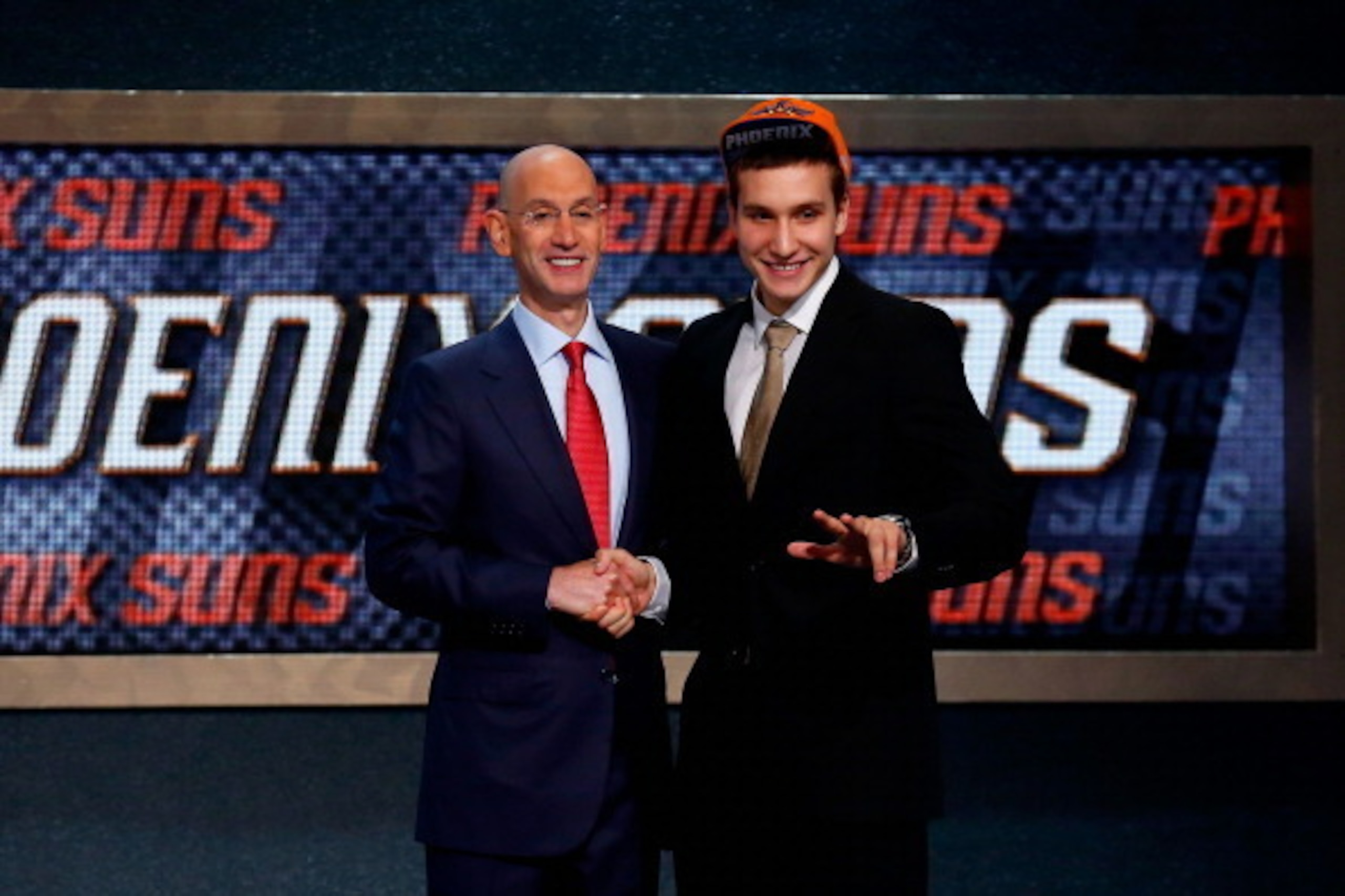 NEW YORK, NY - JUNE 26:  Bogdan Bogdanovic of Serbia (R) shakes hands with NBA Commissioner Adam Silver after being drafted with the #27 overall pick by the Phoenix Suns during the 2014 NBA Draft at Barclays Center on June 26, 2014 in the Brooklyn borough