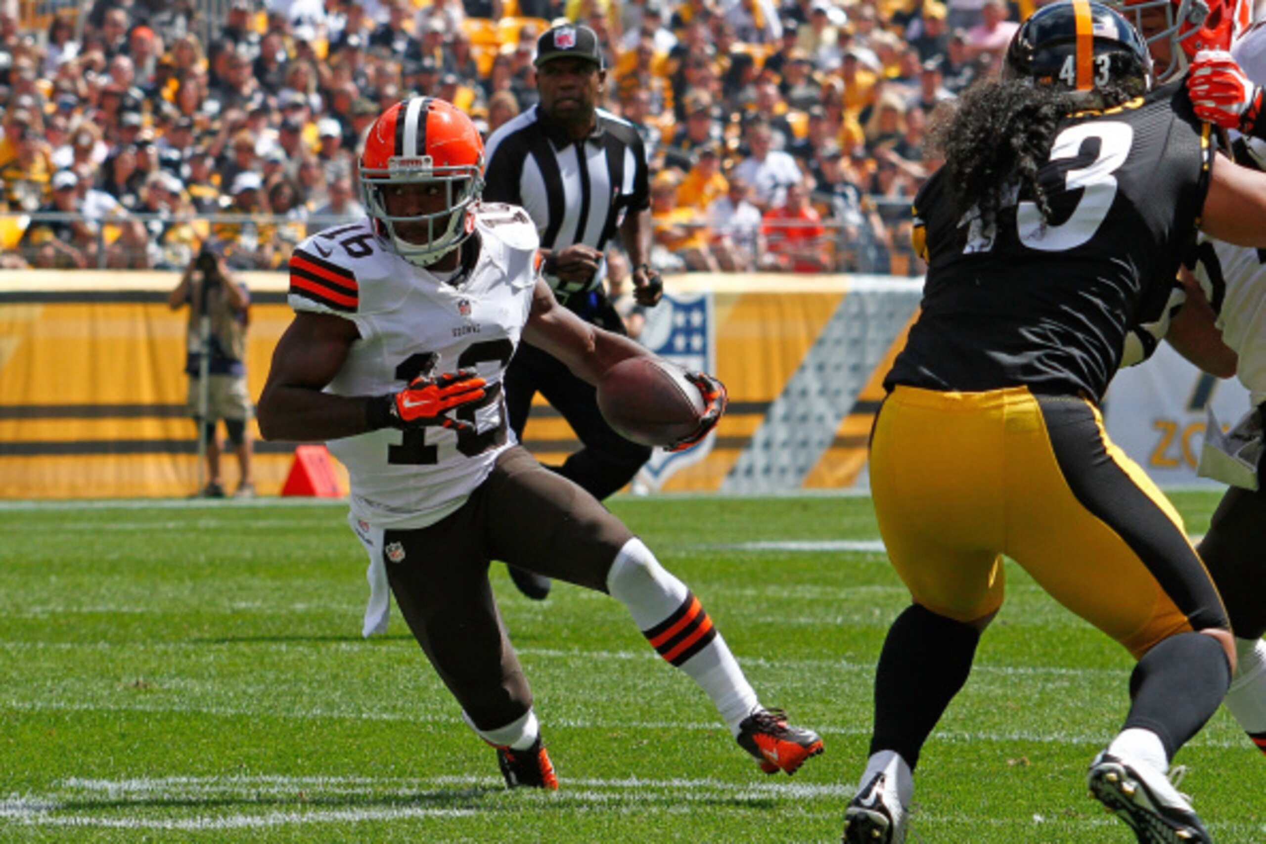 PITTSBURGH, PA - SEPTEMBER 7:  Andrew Hawkins #16 of the Cleveland Browns carries the ball in front of Troy Polamalu #43 of the Pittsburgh Steelers during the first quarter at Heinz Field on September 7, 2014 in Pittsburgh, Pennsylvania.  (Photo by Justin