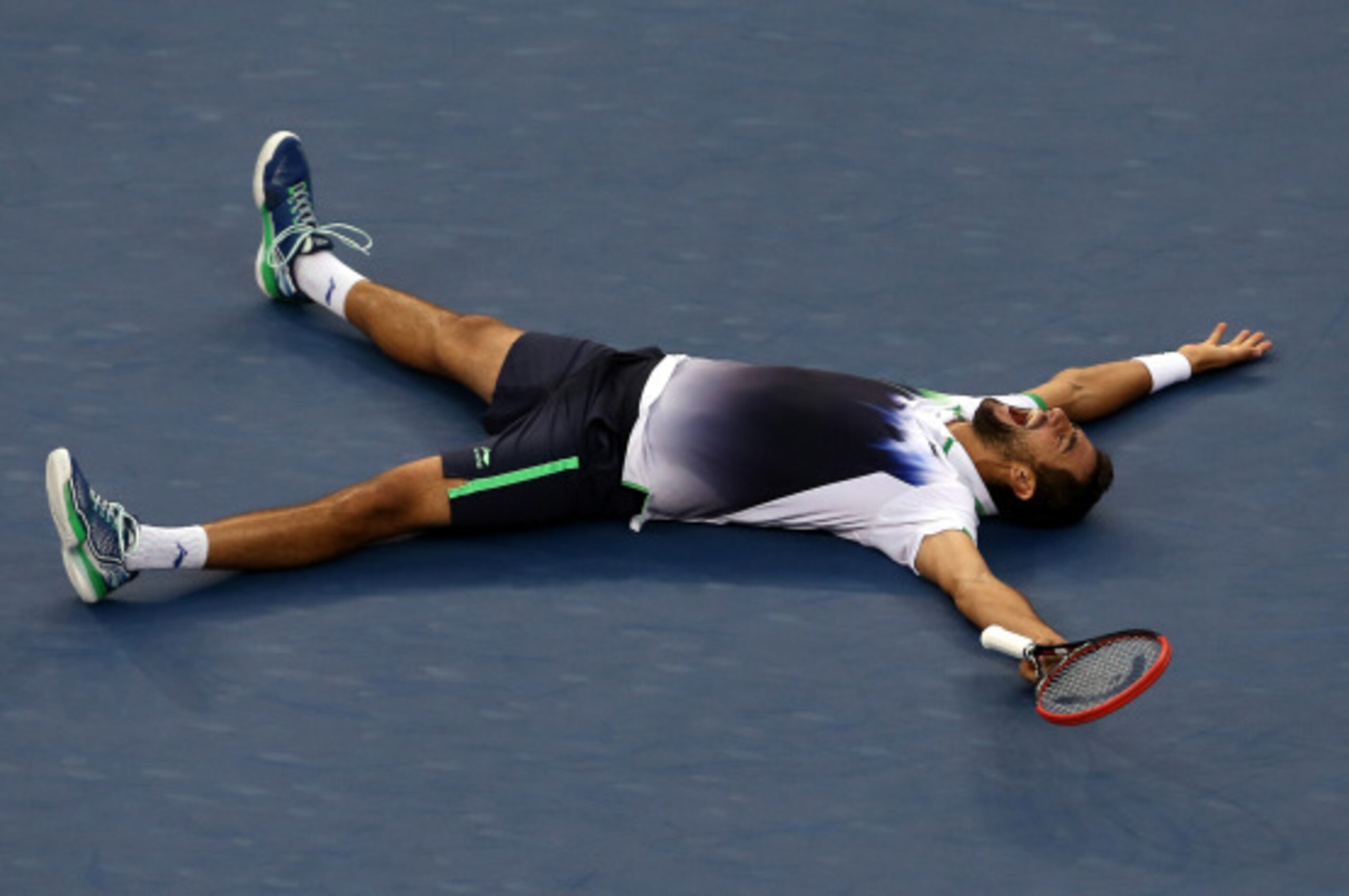 NEW YORK, NY - SEPTEMBER 08:  Marin Cilic of Croatia reacts after defeating Kei Nishikori of Japan to win the men's singles final match on Day fifteen of the 2014 US Open at the USTA Billie Jean King National Tennis Center on September 8, 2014 in the Flus