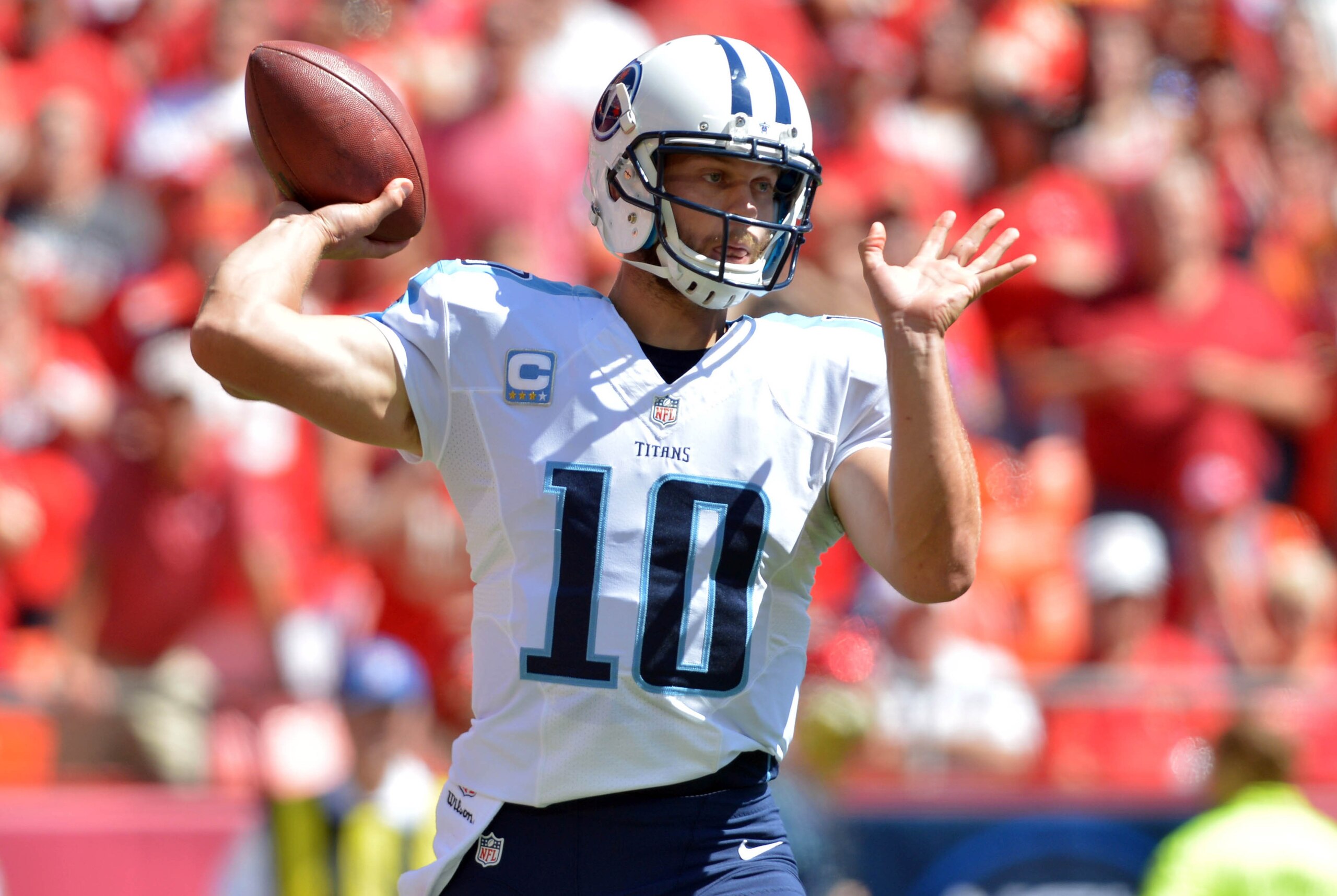 Sep 7, 2014; Kansas City, MO, USA; Tennessee Titans quarterback Jake Locker (10) throws a pass during the first half against the Kansas City Chiefs at Arrowhead Stadium. Mandatory Credit: Denny Medley-USA TODAY Sports