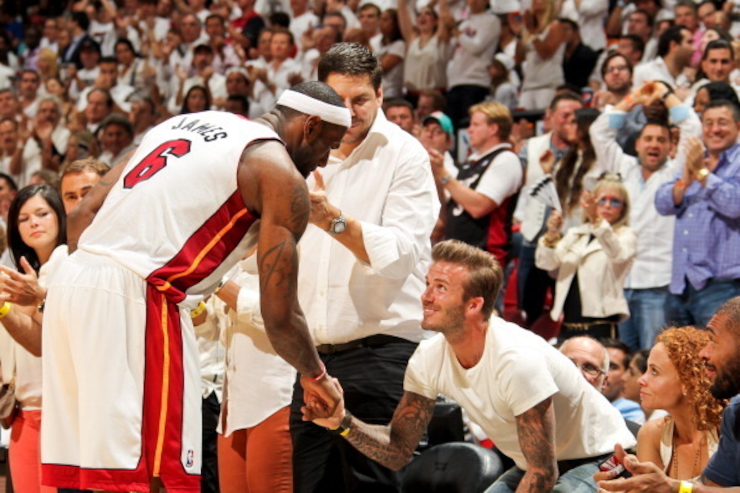 MIAMI, FL - JUNE 3: LeBron James #6 of the Miami Heat greets former MLS player David Beckham after playing against the Indiana Pacers in Game Seven of the Eastern Conference Finals during the 2013 NBA Playoffs on June 3, 2013 at American Airlines Arena in