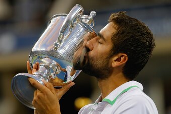 NEW YORK, NY - SEPTEMBER 08:  Marin Cilic of Croatia celebrates with the trophy after defeating Kei Nishikori of Japan to win the men's singles final match during their New York City Trophy Tour on September 8, 2014 in New York City.  (Photo by Chris Trot