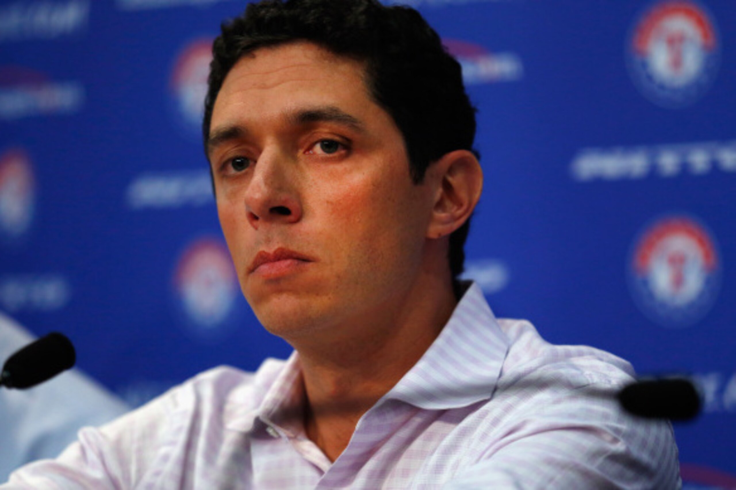 ARLINGTON, TX - SEPTEMBER 05:  President of Baseball Operations and General Manager Jon Daniels of the Texas Rangers talks with the media after announcing the resignation of Manager Ron Washington at Globe Life Park in Arlington on September 5, 2014 in Ar