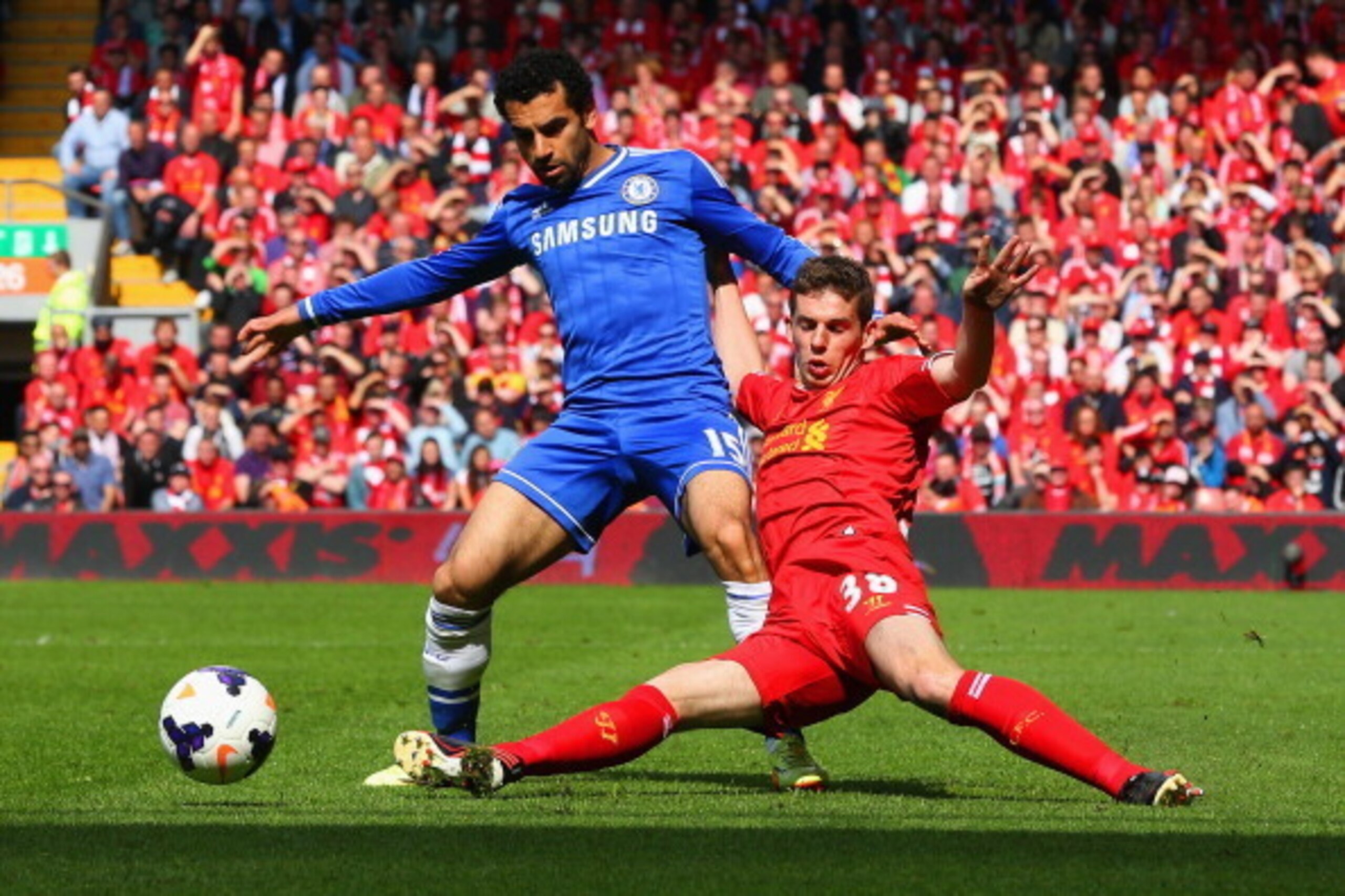 LIVERPOOL, ENGLAND - APRIL 27:  Mohamed Salah of Chelsea is tackled by Jon Flanagan of Liverpool during the Barclays Premier League match between Liverpool and Chelsea at Anfield on April 27, 2014 in Liverpool, England.  (Photo by Clive Brunskill/Getty Im