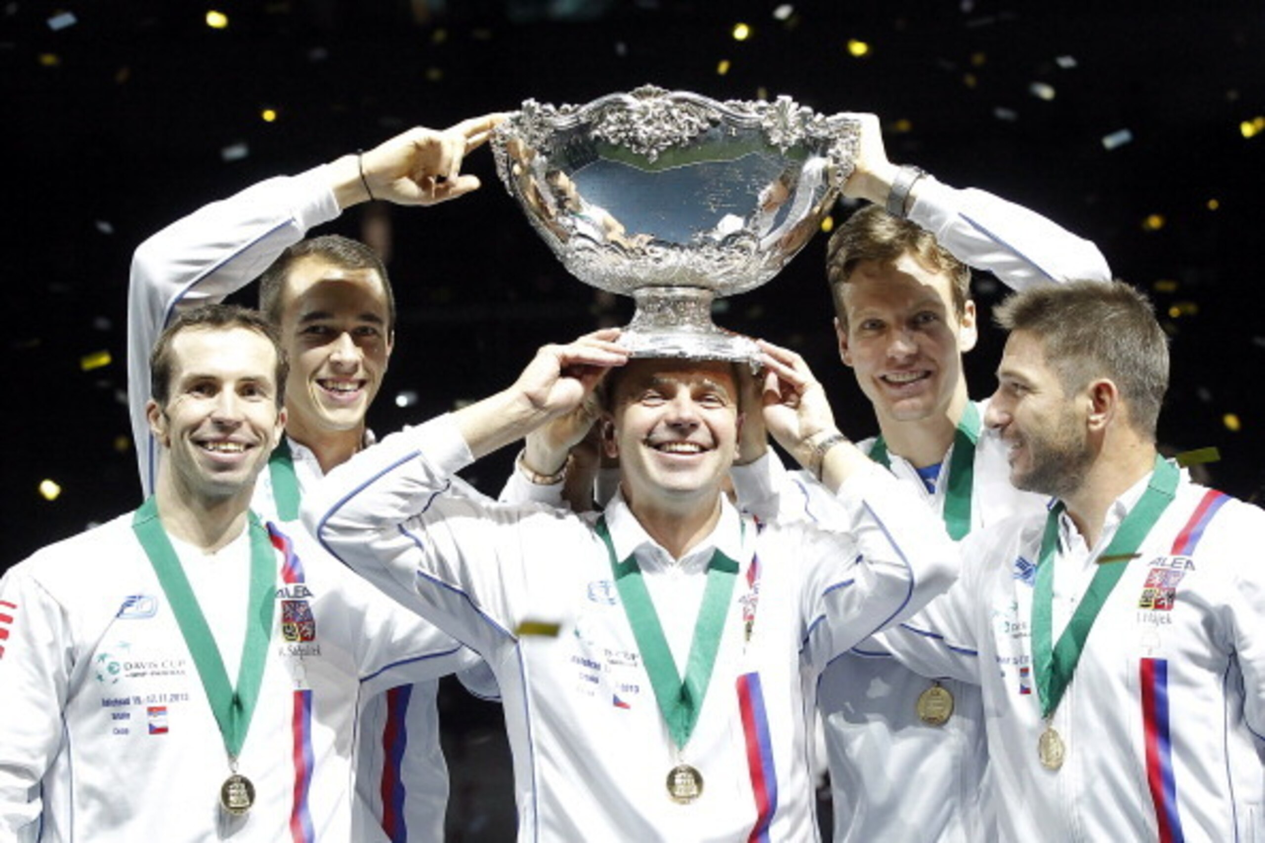 BELGRADE, SERBIA - NOVEMBER 17: L-R Radek Stepanek Lukas Rosol team captain Vladimir Safarik Tomas Berdych and Jan Hayek of Czech Republic hold the winners trophy aloft after a 3-2 victory against Serbia during the award ceremony of the Davis Cup World G BELGRADE, SERBIA - NOVEMBER 17: L-R Radek Stepanek Lukas Rosol team captain Vladimir Safarik Tomas Berdych and Jan Hayek of Czech Republic hold the winners trophy aloft after a 3-2 victory against Serbia during the award ceremony of the Davis Cup World G