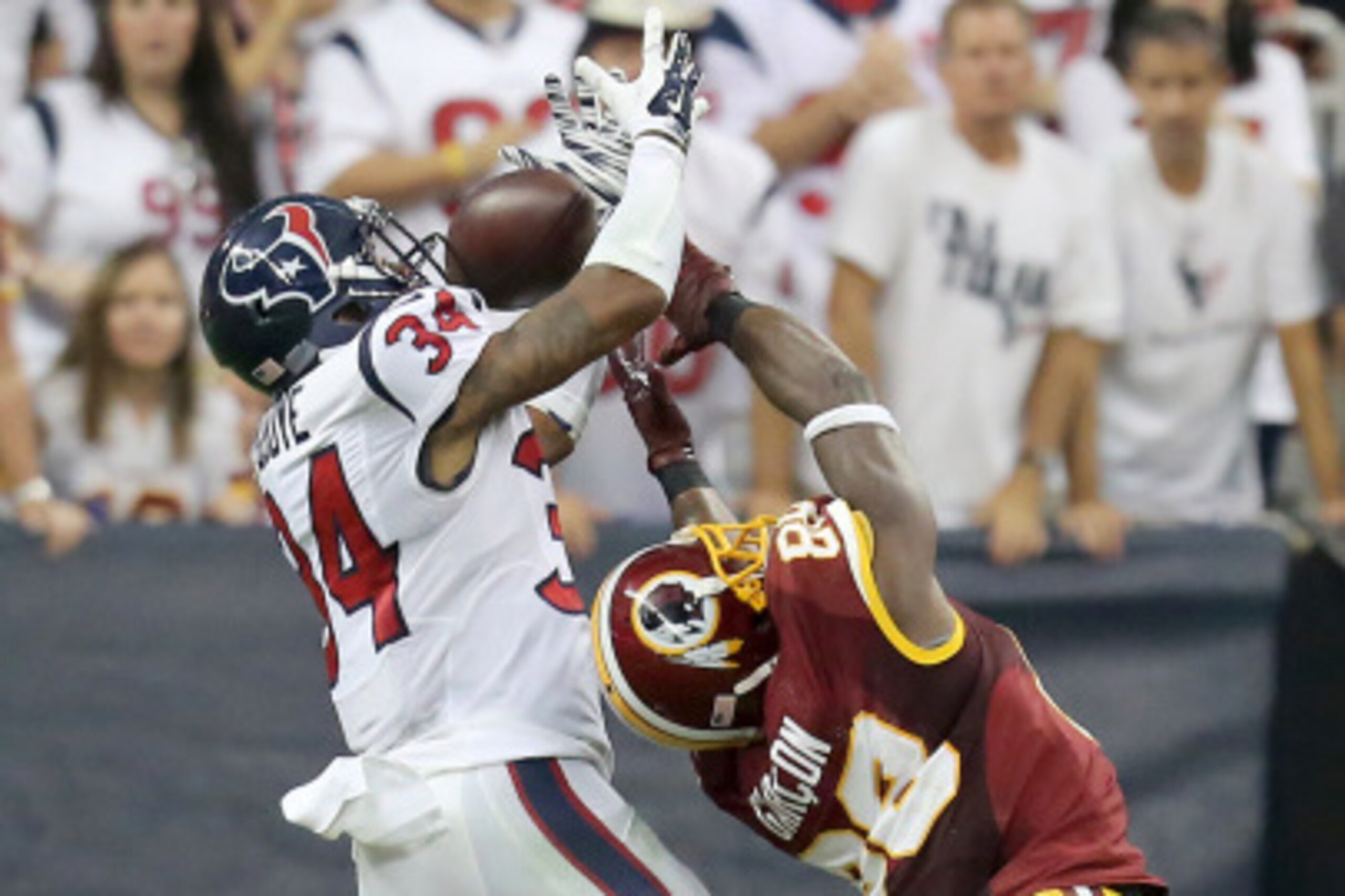 HOUSTON, TX- SEPTEMBER 07: Cornerback A.J. Bouye #34 of theHouston Texans breaks up the pass intended for wide receiver Pierre Garcon #88 of the Washington Redskins in the third quarter on September 7, 2014 at NRG Stadium in Houston, Texas. (Photo by Tho HOUSTON, TX- SEPTEMBER 07: Cornerback A.J. Bouye #34 of theHouston Texans breaks up the pass intended for wide receiver Pierre Garcon #88 of the Washington Redskins in the third quarter on September 7, 2014 at NRG Stadium in Houston, Texas. (Photo by Tho