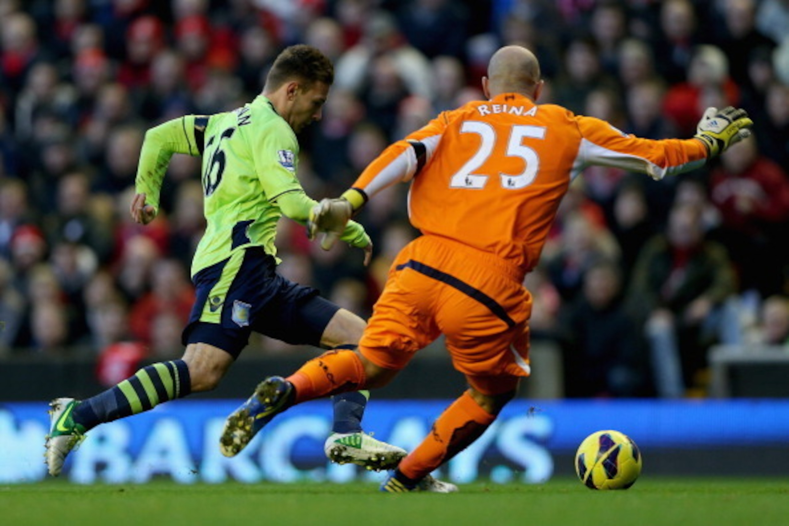 LIVERPOOL, ENGLAND - DECEMBER 15:  Andreas Weimann of Aston Villa attempts to run round Pepe Reina of Liverpool during the Barclays Premier League match between Liverpool and Aston Villa at Anfield on  December 15, 2012 in Liverpool, England.  (Photo by C