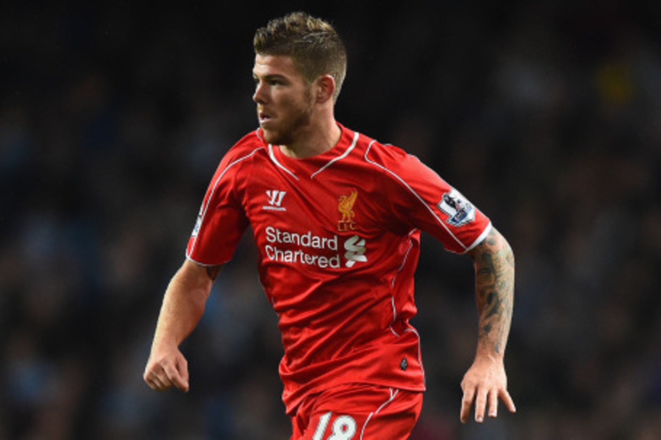 MANCHESTER, ENGLAND - AUGUST 25:   Alberto Moreno of Liverpool  in action during the Barclays Premier League match between Manchester City and Liverpool at the Etihad Stadium on August 25, 2014 in Manchester, England.  (Photo by Laurence Griffiths/Getty I