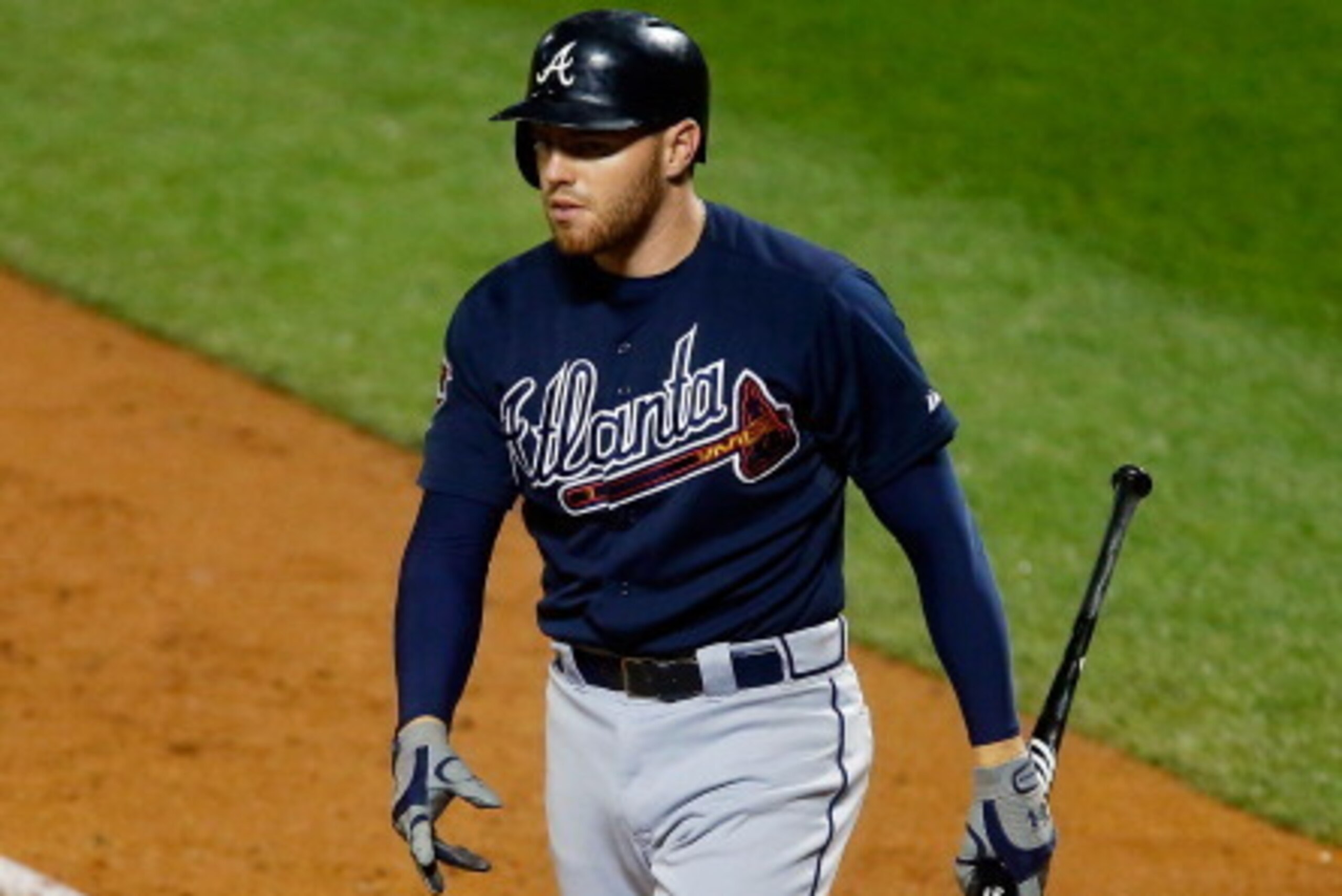 NEW YORK, NY - JULY 09:  Freddie Freeman #5 of the Atlanta Braves walks back to the dugout after striking out in the ninth inning against the New York Mets at Citi Field on July 9, 2014 in the Flushing neighborhood of the Queens borough of New York City. 