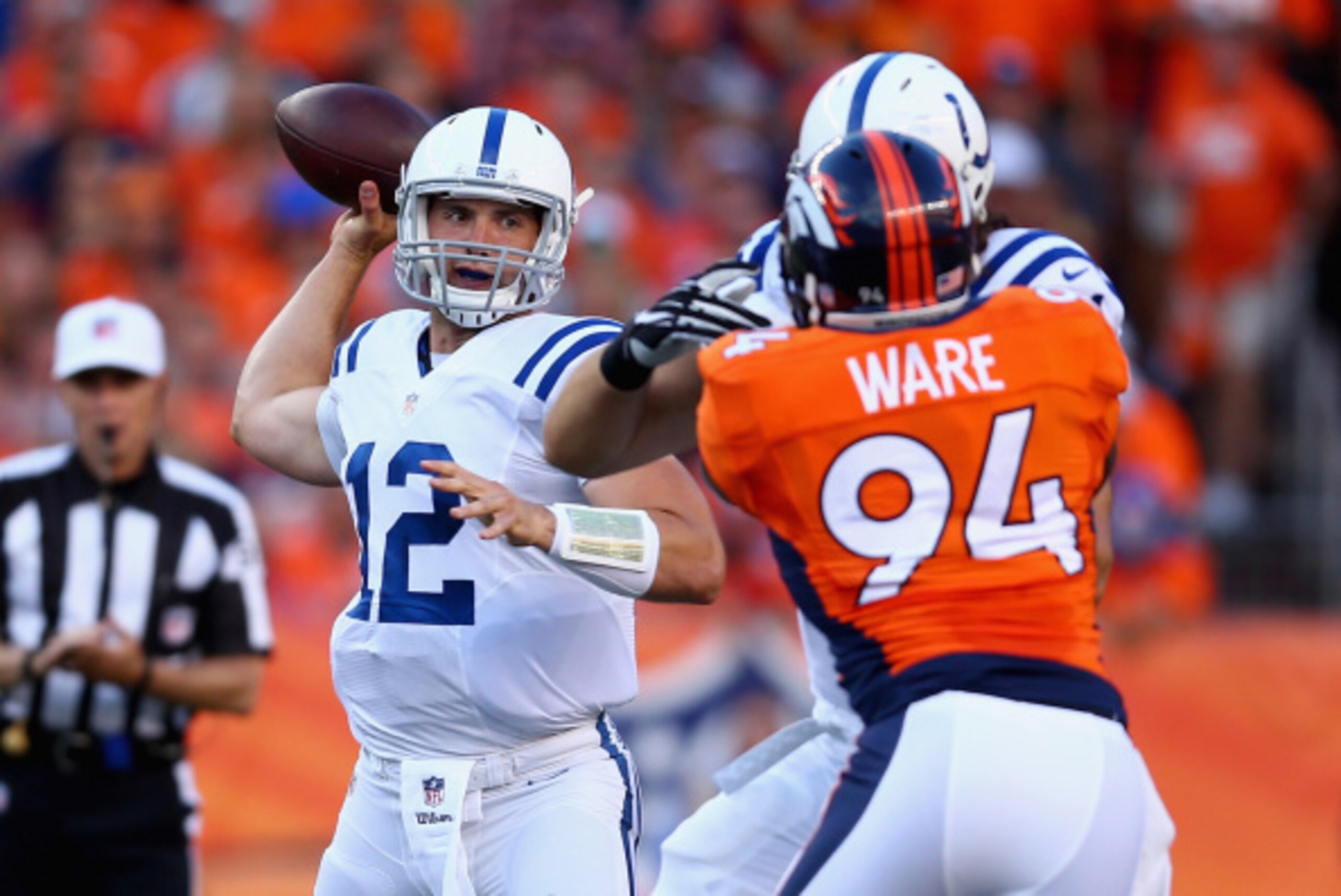 DENVER, CO - SEPTEMBER 07: Quarterback Andrew Luck #12 of the Indianapolis Colts drops back to pass against the Denver Broncos at Sports Authority Field at Mile High on September 7, 2014 in Denver, Colorado. (Photo by Jeff Gross/Getty Images) DENVER, CO - SEPTEMBER 07: Quarterback Andrew Luck #12 of the Indianapolis Colts drops back to pass against the Denver Broncos at Sports Authority Field at Mile High on September 7, 2014 in Denver, Colorado. (Photo by Jeff Gross/Getty Images)