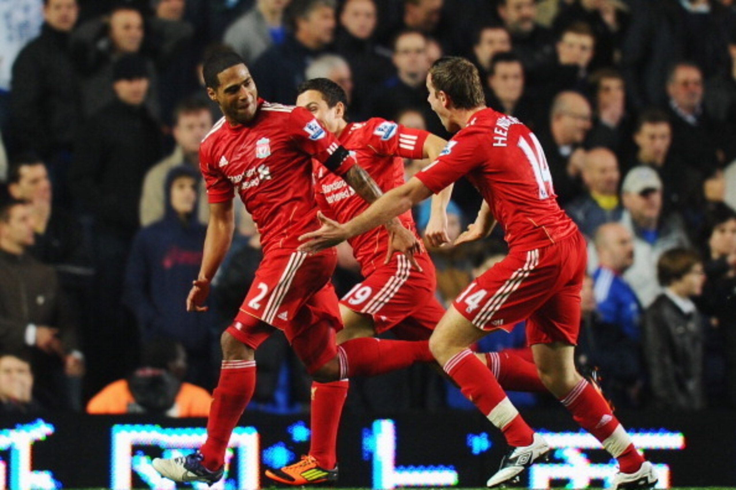 LONDON, ENGLAND - NOVEMBER 20:  Glen Johnson (L) of Liverpool celebrates his goal with Stewart Downing and Jordan Henderson during the Barclays Premier League match between Chelsea and Liverpool at Stamford Bridge on November 20, 2011 in London, England. 