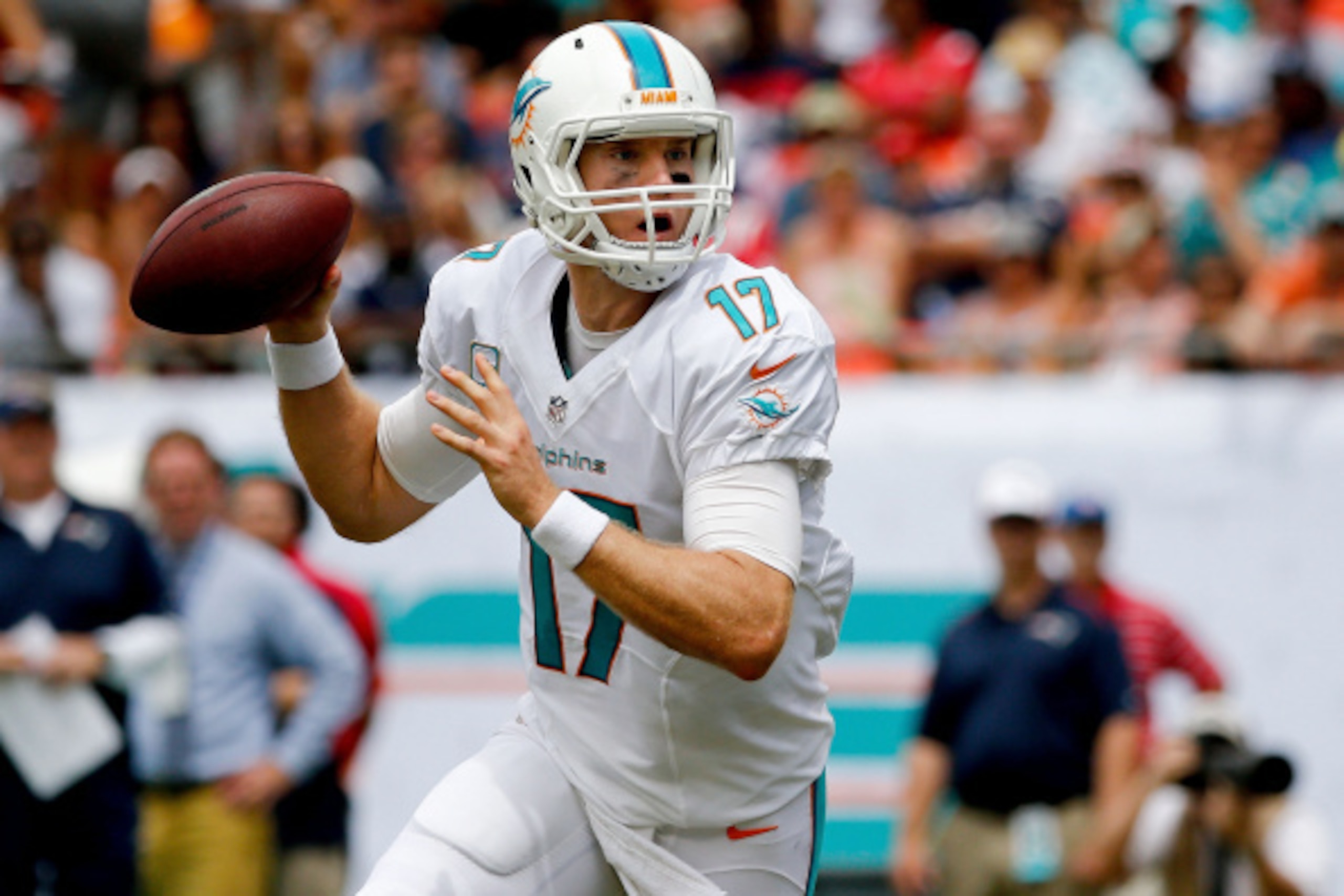 MIAMI GARDENS, FL - SEPTEMBER 07: Ryan Tannehill #17 of the Miami Dolphins scrambles in the pocket during the first quarter of the game against the New England Patriots at Sun Life Stadium on September 7, 2014 in Miami Gardens, Florida.  (Photo by Rob Fol