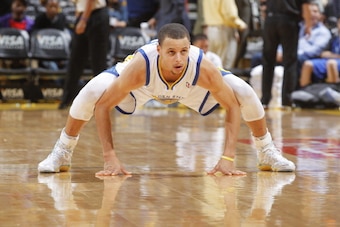 OAKLAND, CA - MARCH 14: Stephen Curry #30 of the Golden State Warriors on defense against the Cleveland Cavaliers on March 14, 2014 at Oracle Arena in Oakland, California. NOTE TO USER: User expressly acknowledges and agrees that, by downloading and or us