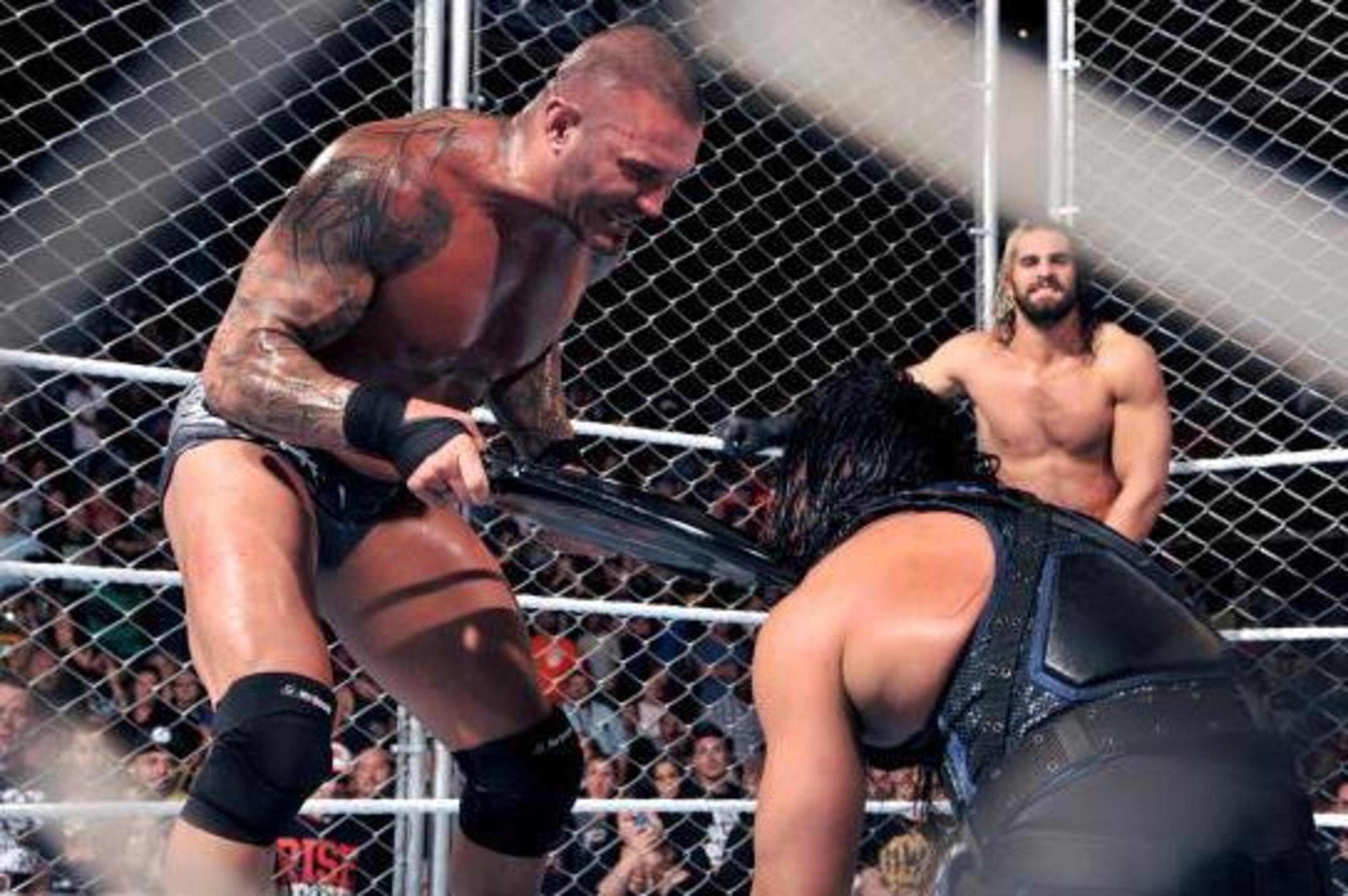 Randy Orton toys with Roman Reigns. Randy Orton toys with Roman Reigns.