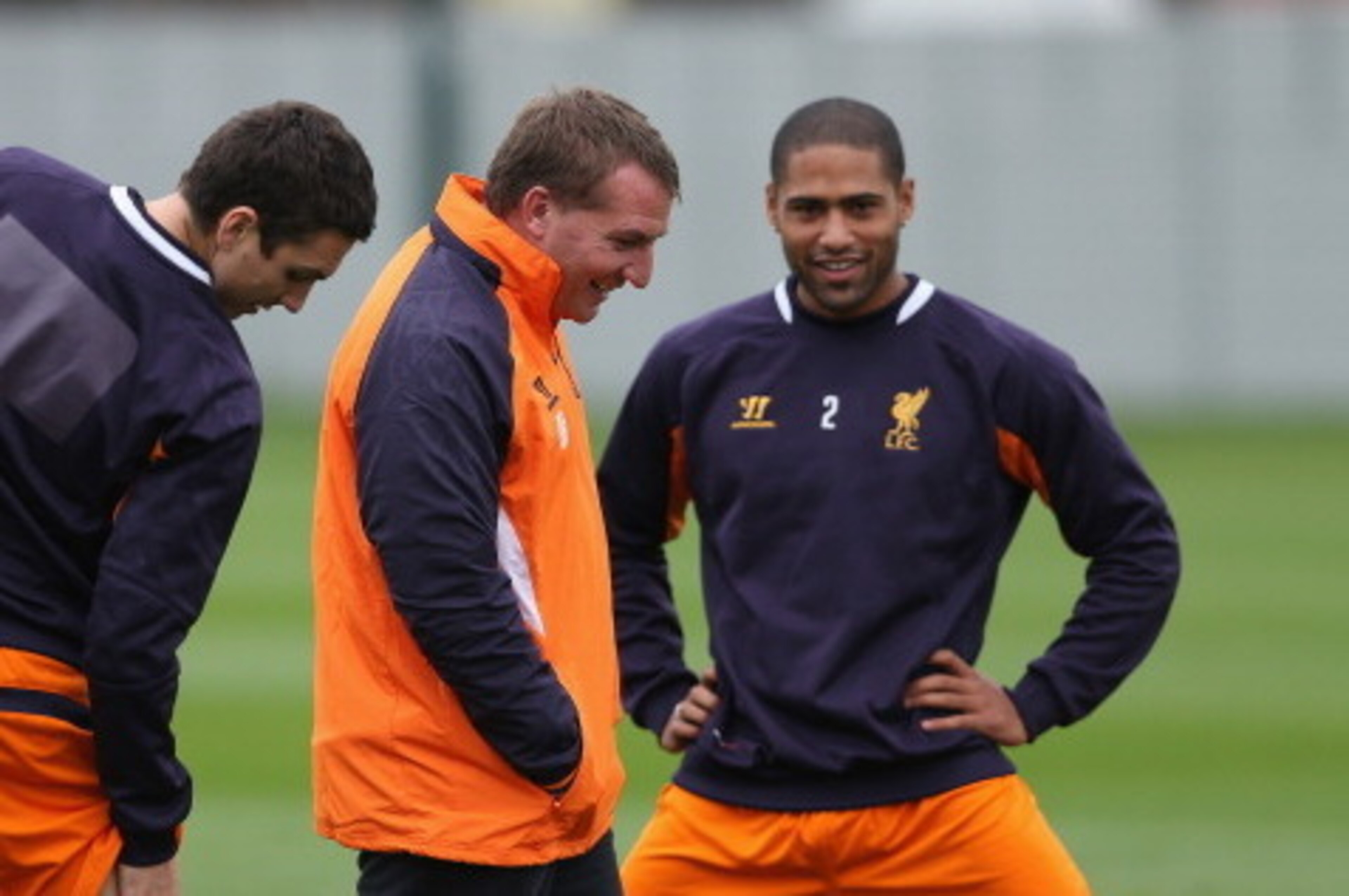 LIVERPOOL, ENGLAND - OCTOBER 24:  Liverpool manager Brendan Rodgers in good spirits with Glen Johnson and Stewart Downing during a training session ahead of their UEFA Europa League group match against FC Anzhi Makhachkala at Melwood Training Ground on Oc