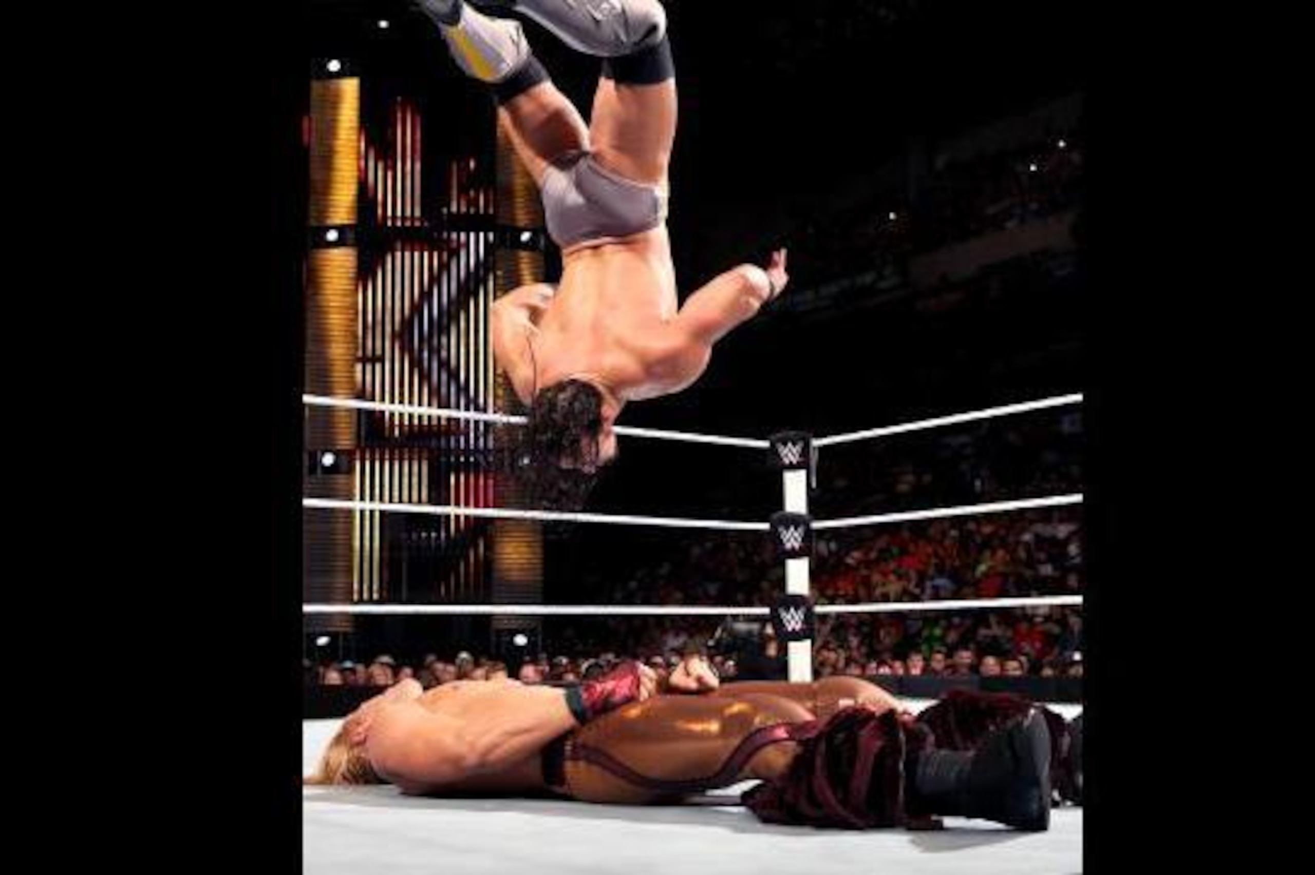 Adrian Neville set to land on Tyler Breeze.
