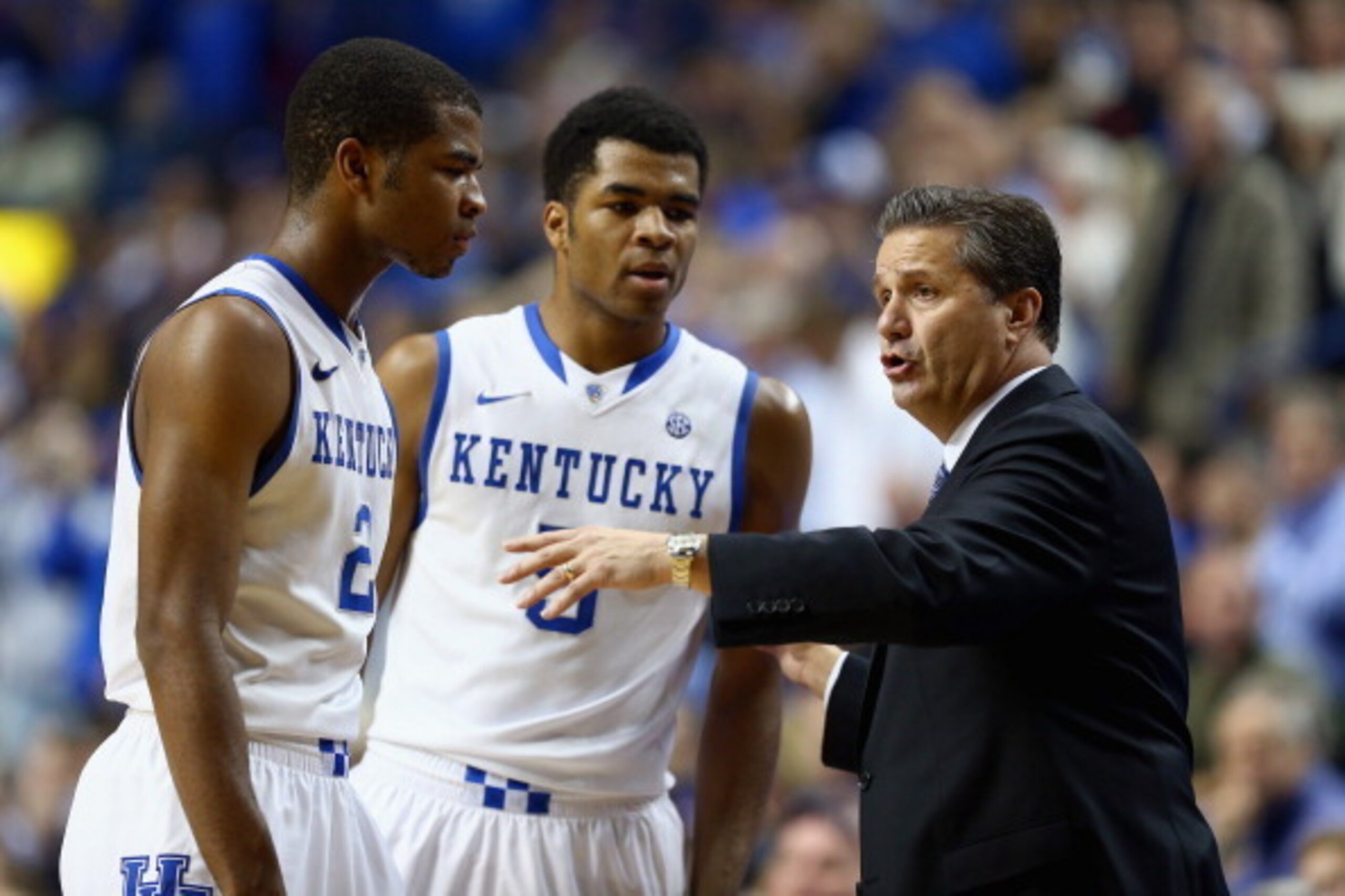 LEXINGTON, KY - NOVEMBER 25:  John Calipari the head coach of the Kentucky Wildcats talks with Aaron Harrison #2 and Andrew Harrison #5 during the game against the Cleveland State Vikings at Rupp Arena on November 25, 2013 in Lexington, Kentucky.  (Photo 