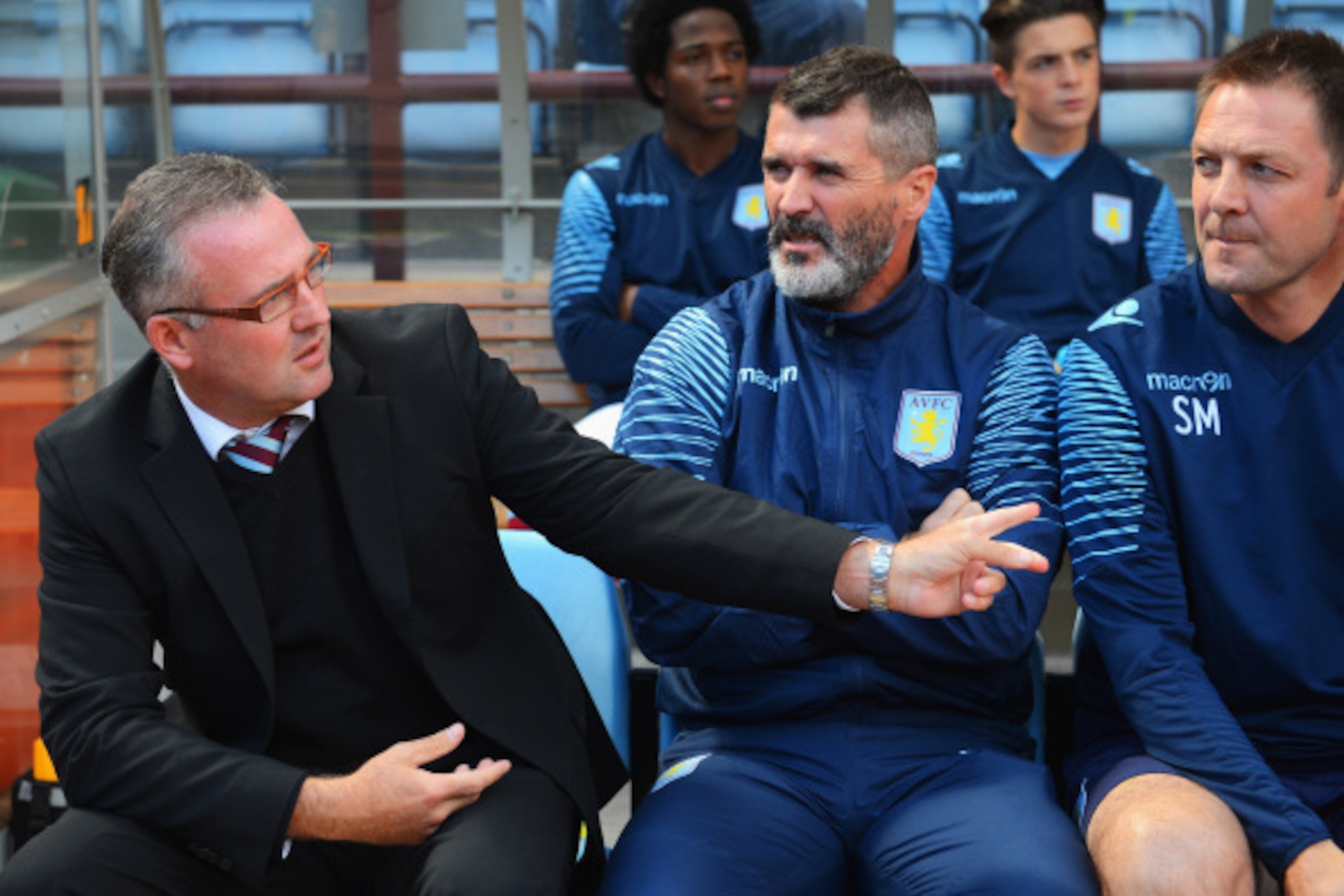 BIRMINGHAM, ENGLAND - AUGUST 23:  Manager Paul Lambert (L) of Aston Villa talks to assistant Roy Keane during the Barclays Premier League match between Aston Villa and Newcastle United at Villa Park on August 23, 2014 in Birmingham, England.  (Photo by Mi