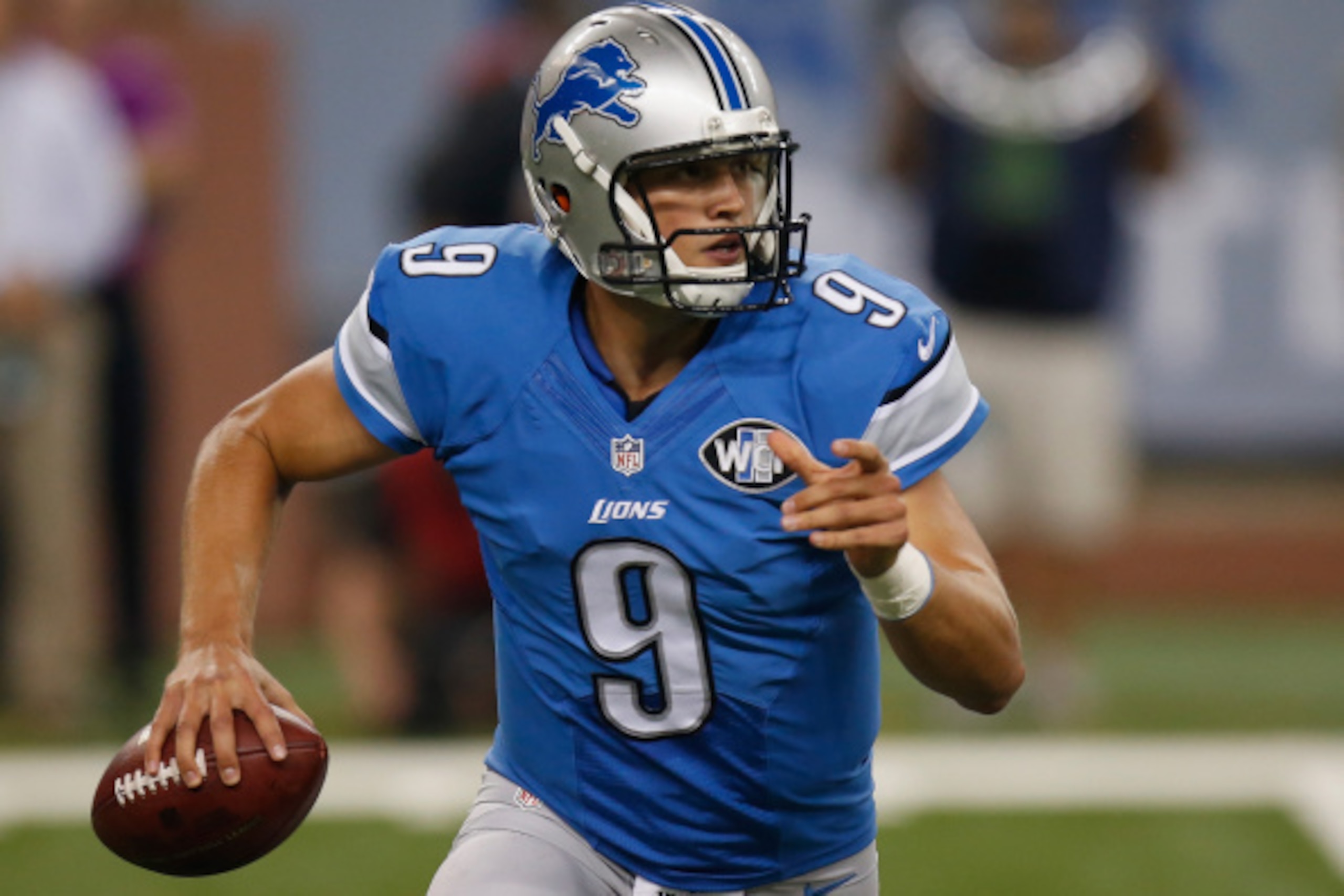 DETROIT, MI - SEPTEMBER 08: Matthew Stafford #9 of the Detroit Lions scrambles prior to throwing a first quarter touchdown against the New York Giants at Ford Field on September 8, 2014 in Detroit, Michigan. (Photo by Gregory Shamus/Getty Images)
