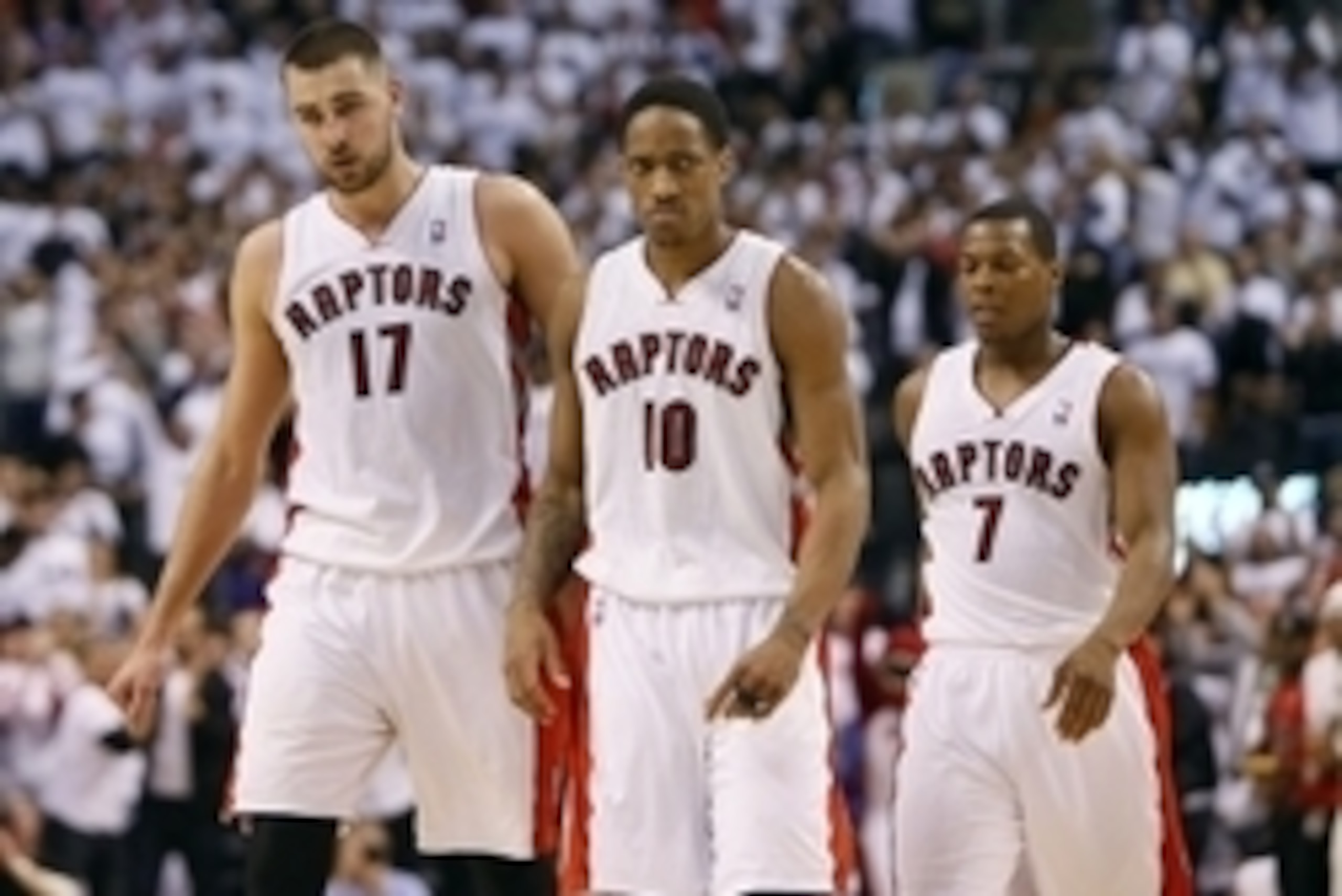 Apr 22, 2014; Toronto, Ontario, CAN; Toronto Raptors guard DeMar DeRozan (10) and center Jonas Valanciunas (17) and guard Kyle Lowry (7) come off the court after a play against the Brooklyn Nets in game two during the first round of the 2014 NBA Playoffs