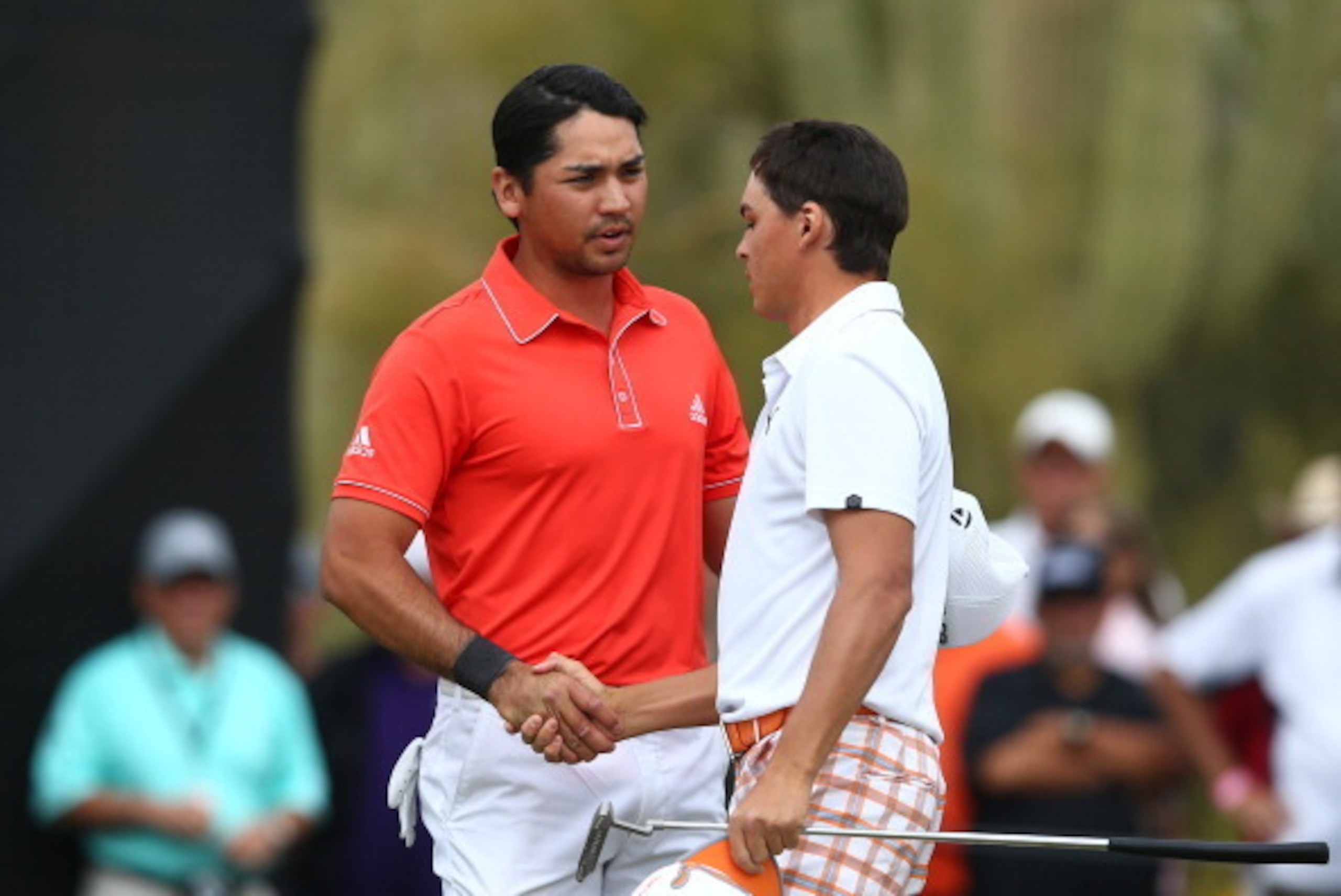 MARANA, AZ - FEBRUARY 23:  Jason Day of Australia (L) and Rickie Fowler of USA shake hands after Day defeated Fowler 3 and 2 in their semifinal match during the semifinal round of the World Golf Championships - Accenture Match Play Championship at The Gol