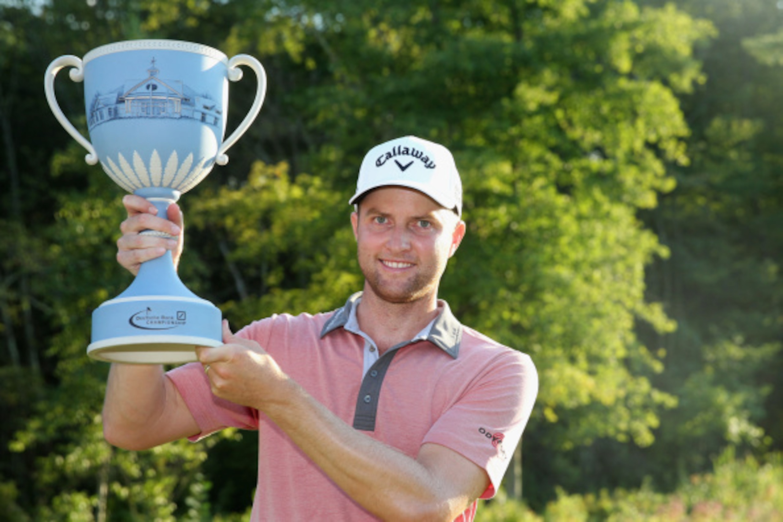 NORTON, MA - SEPTEMBER 01:  Chris Kirk is presented with the winner's trophy after winning the Deutsche Bank Championship at the TPC Boston on September 1, 2014 in Norton, Massachusetts.  (Photo by Jim Rogash/Getty Images)