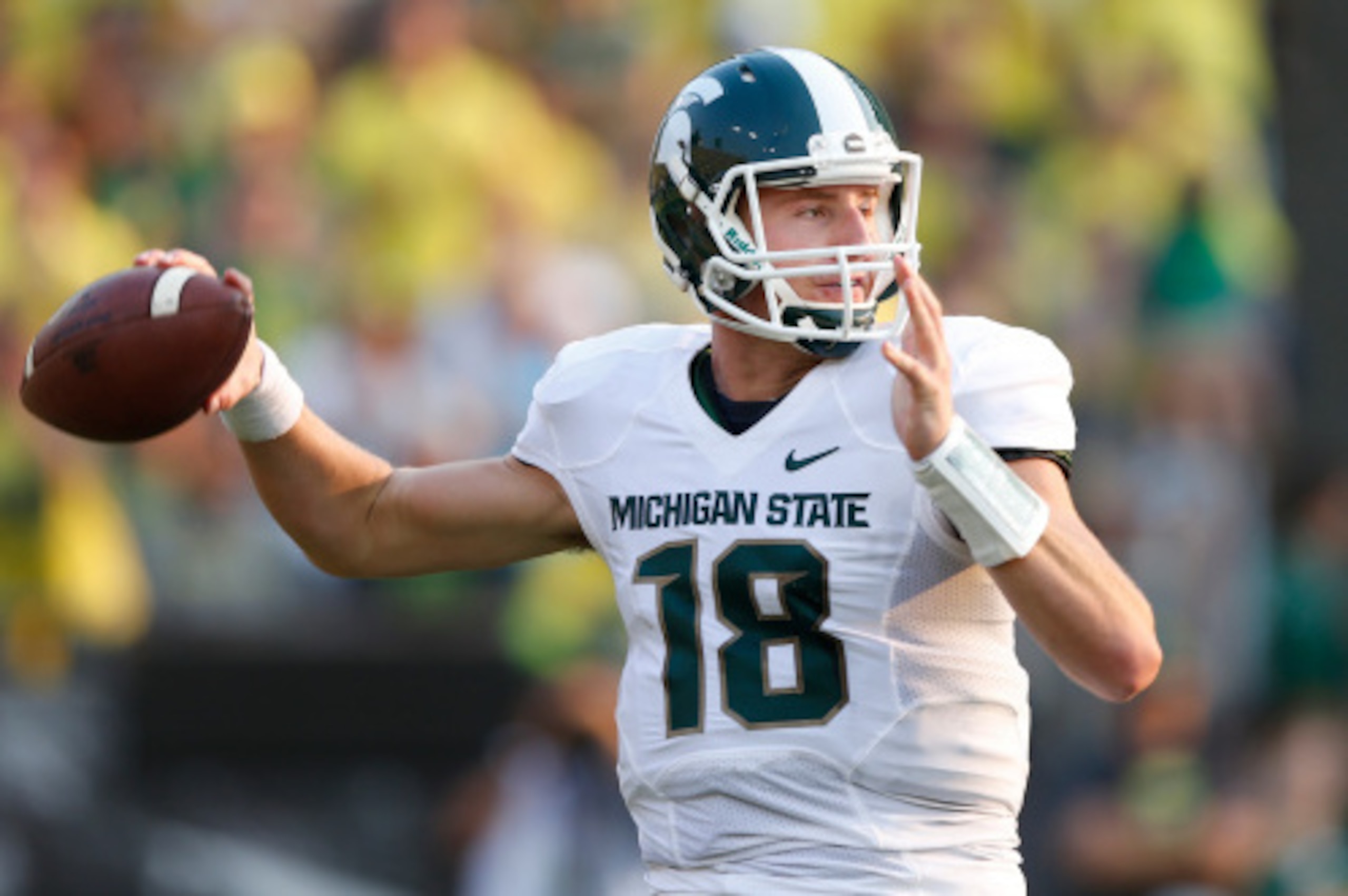 EUGENE, OR - SEPTEMBER 6: Connor Cook #18 of the Michigan State Spartans passes the ball in the second half of the game against the Oregon Ducks at Autzen Stadium on September 6, 2014 in Eugene, Oregon. Oregon won 46-27. (Photo by Joe Robbins/Getty Images