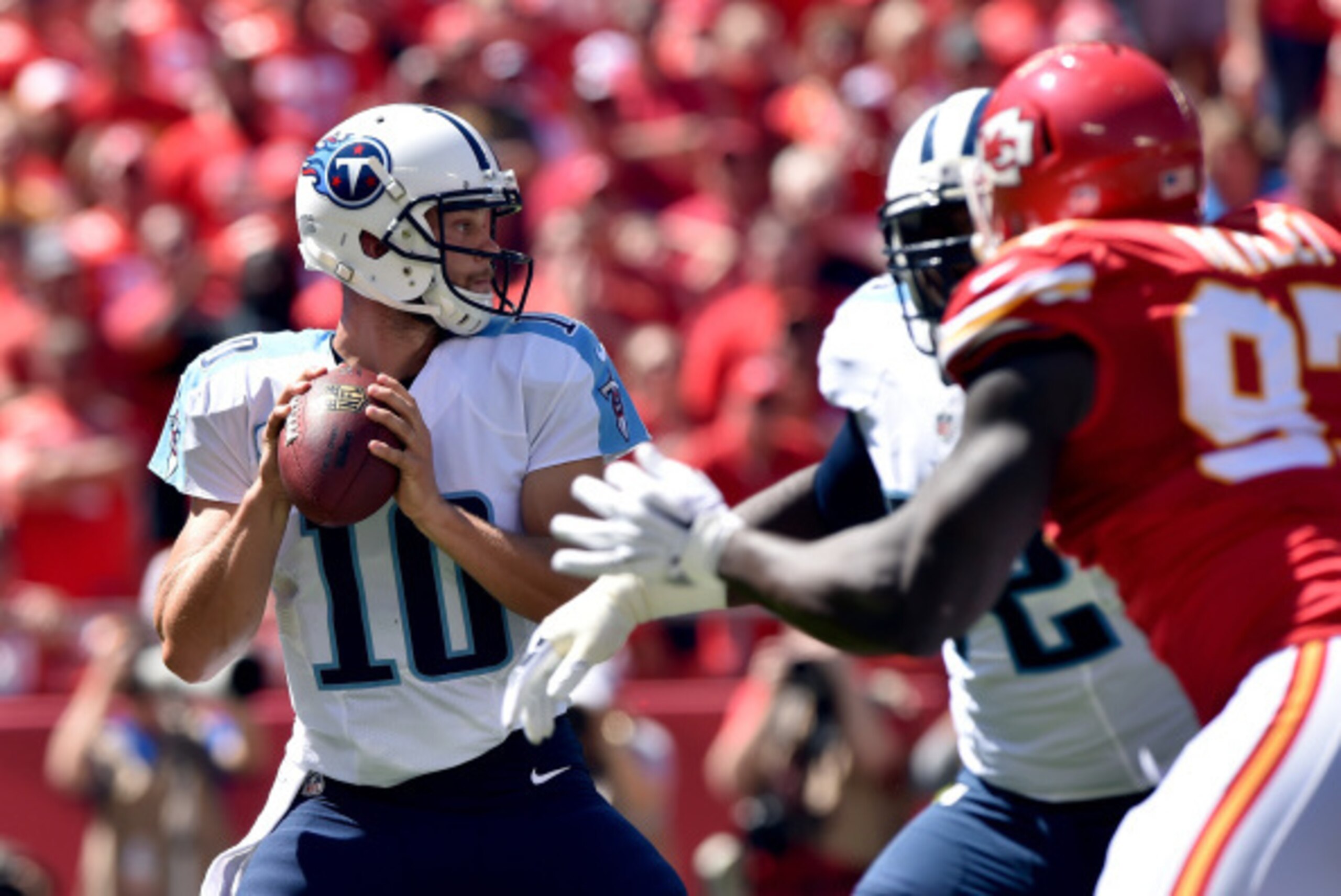 KANSAS CITY, MO - SEPTEMBER 07: Jake Locker #10 of the Tennessee Titans drops back to pass against the Kansas City Chiefs during the first half at Arrowhead Stadium on September 7, 2014 in Kansas City, Missouri.  (Photo by Peter Aiken/Getty Images)