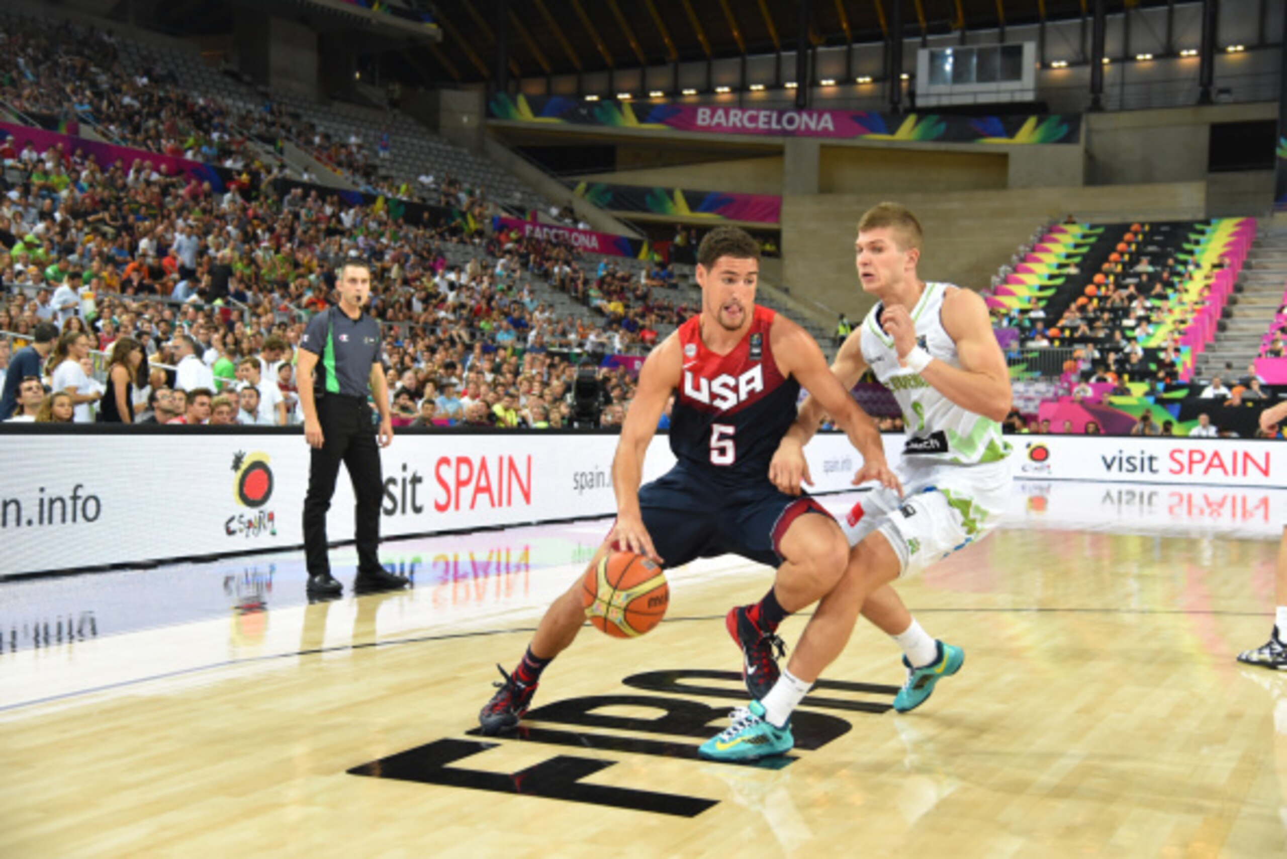 BARCELONA, SPAIN - SEPTEMBER 9: Klay Thompson #5 of the USA Basketball Men's National Team drives against the Slovenia National Team during the 2014 FIBA World Cup quarter-finals at Palau Sant Jordi on September 9, 2014 in Barcelona, Spain.  NOTE TO USER: