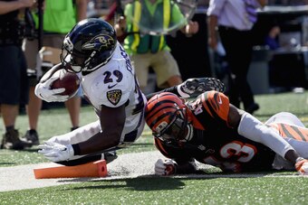 BALTIMORE, MD - SEPTEMBER 07:  Running back Justin Forsett #29 of the Baltimore Ravens scores a touchdown against George Iloka #43 of the Cincinnati Bengals at M&T Bank Stadium on September 7, 2014 in Baltimore, Maryland.  (Photo by Patrick Smith/Getty Im
