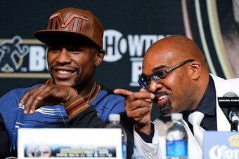 LAS VEGAS, NV - APRIL 30:  WBC welterweight champion Floyd Mayweather Jr. (L) and CEO of Mayweather Promotions Leonard Ellerbe attend a news conference at the MGM Grand Hotel/Casino on April 30, 2014 in Las Vegas, Nevada. Mayweather will fight WBA champio