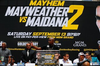 NEW YORK, NY - JULY 14:  Floyd Mayweather Jr. speaks to the media during a news conference at the Pedestrian Walk in Times Square on July 14, 2014 in New York City. Floyd Mayweather Jr. and Marcos Maidana are scheduled to fight September 13, 2014 at the M