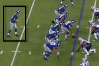 Manning's right foot is staggered back.