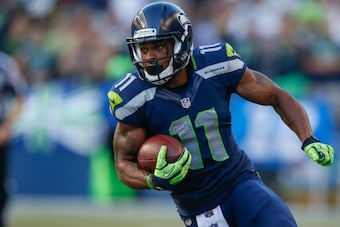 SEATTLE, WA - SEPTEMBER 04:  Wide receiver Percy Harvin #11 of the Seattle Seahawks rushes against the Green Bay Packers at CenturyLink Field on September 4, 2014 in Seattle, Washington.  (Photo by Otto Greule Jr/Getty Images)