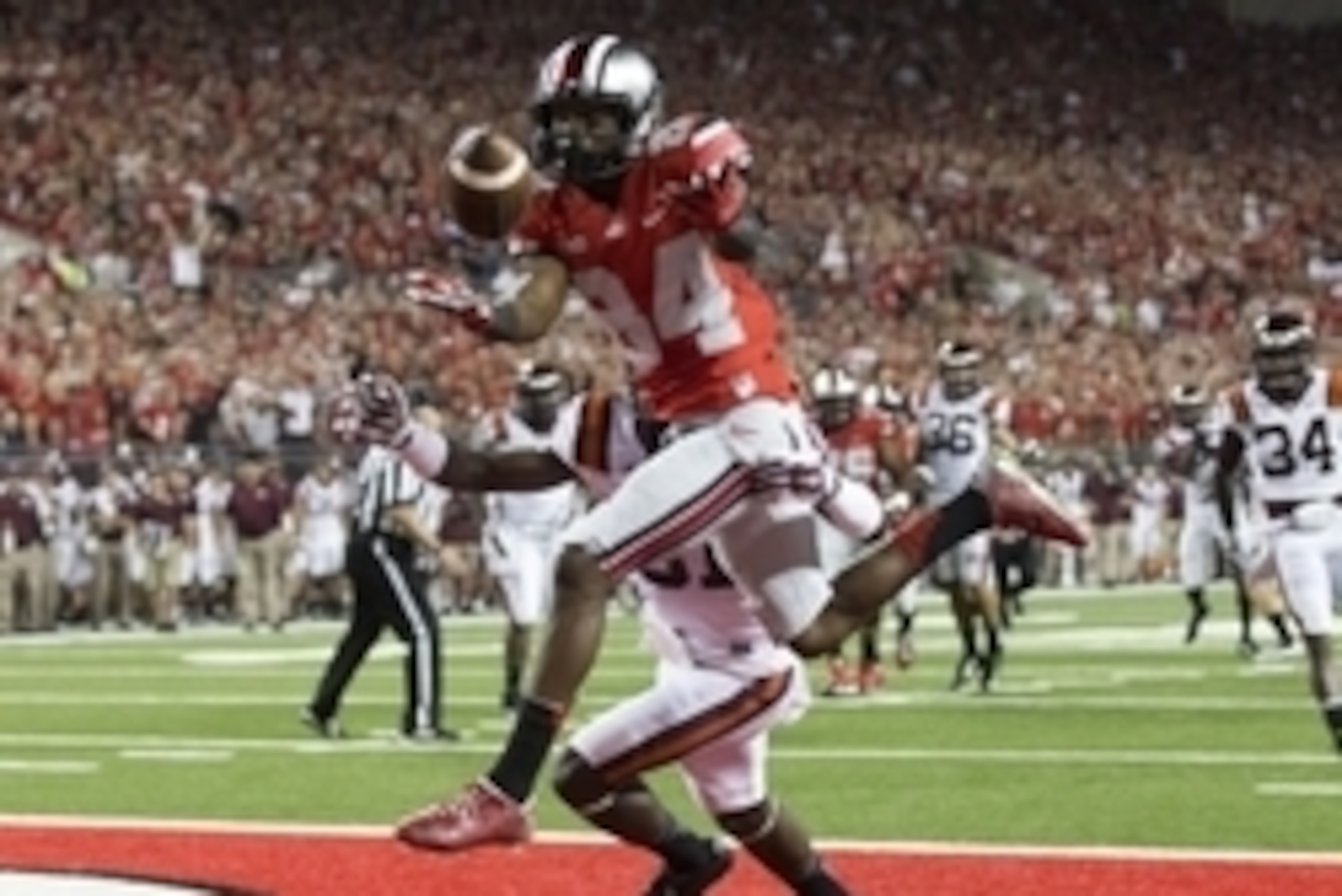 Sep 6, 2014; Columbus, OH, USA; Ohio State Buckeyes wide receiver Corey Smith (84) loses the handle on a pass under pressure from Virginia Tech Hokies cornerback Brandon Facyson (31) at Ohio Stadium. Mandatory Credit: Greg Bartram-USA TODAY Sports Sep 6, 2014; Columbus, OH, USA; Ohio State Buckeyes wide receiver Corey Smith (84) loses the handle on a pass under pressure from Virginia Tech Hokies cornerback Brandon Facyson (31) at Ohio Stadium. Mandatory Credit: Greg Bartram-USA TODAY Sports