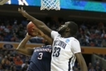 Mar 22, 2014; Buffalo, NY, USA; Connecticut Huskies guard Terrence Samuel (3) shoots as Villanova Wildcats forward Daniel Ochefu (23) defends in the first half of a men's college basketball game during the third round of the 2014 NCAA Tournament at First 