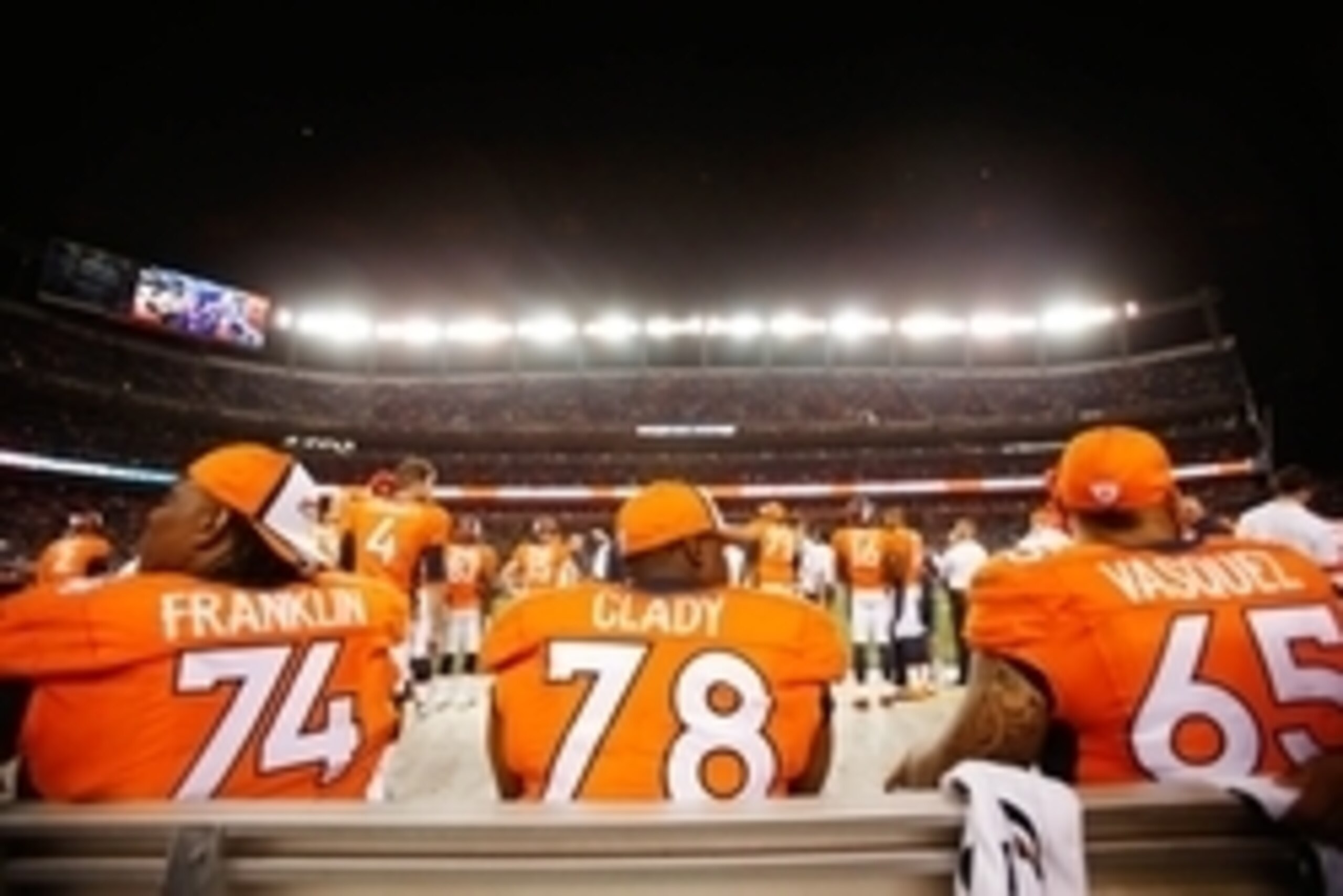 Aug 7, 2014; Denver, CO, USA; Denver Broncos offensive lineman Orlando Franklin (74), Ryan Clady (78), and guard Louis Vasquez (65) during the game against the Seattle Seahawks at Sports Authority Field at Mile High. The Broncos won 21-16. Mandatory Credi