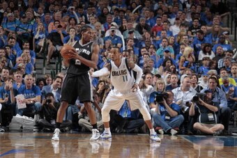 DALLAS, TX - MAY 2: Kawhi Leonard #2 of the San Antonio Spurs posts up against Monta Ellis #11 of the Dallas Mavericks during Game Six of the Western Conference Quarterfinals during the 2014 NBA Playoffs on May 2, 2014 at the American Airlines Center in D