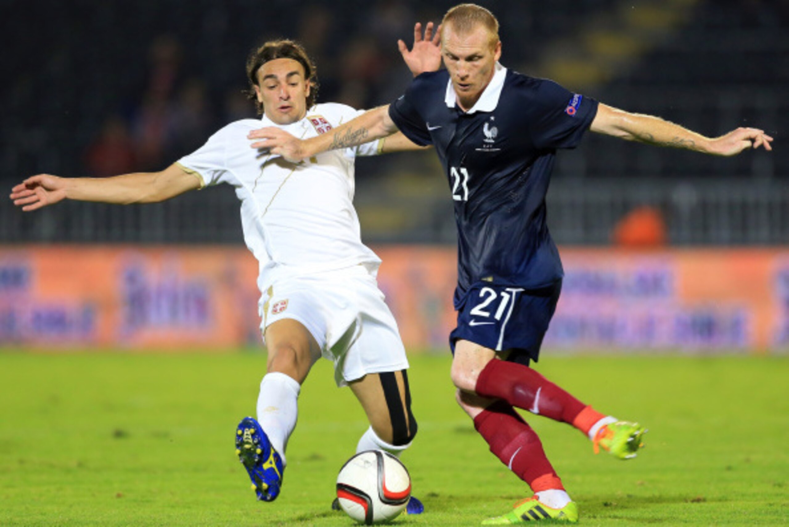 BELGRADE, SERBIA - SEPTEMBER 07: Jeremy Mathieu (R) of France competes for the ball with Lazar Markovic (L) of Serbia during the International friendly match between Serbia and France at the Stadium JNA on September 07, 2014 in Belgrade, Serbia, 2014. (Ph