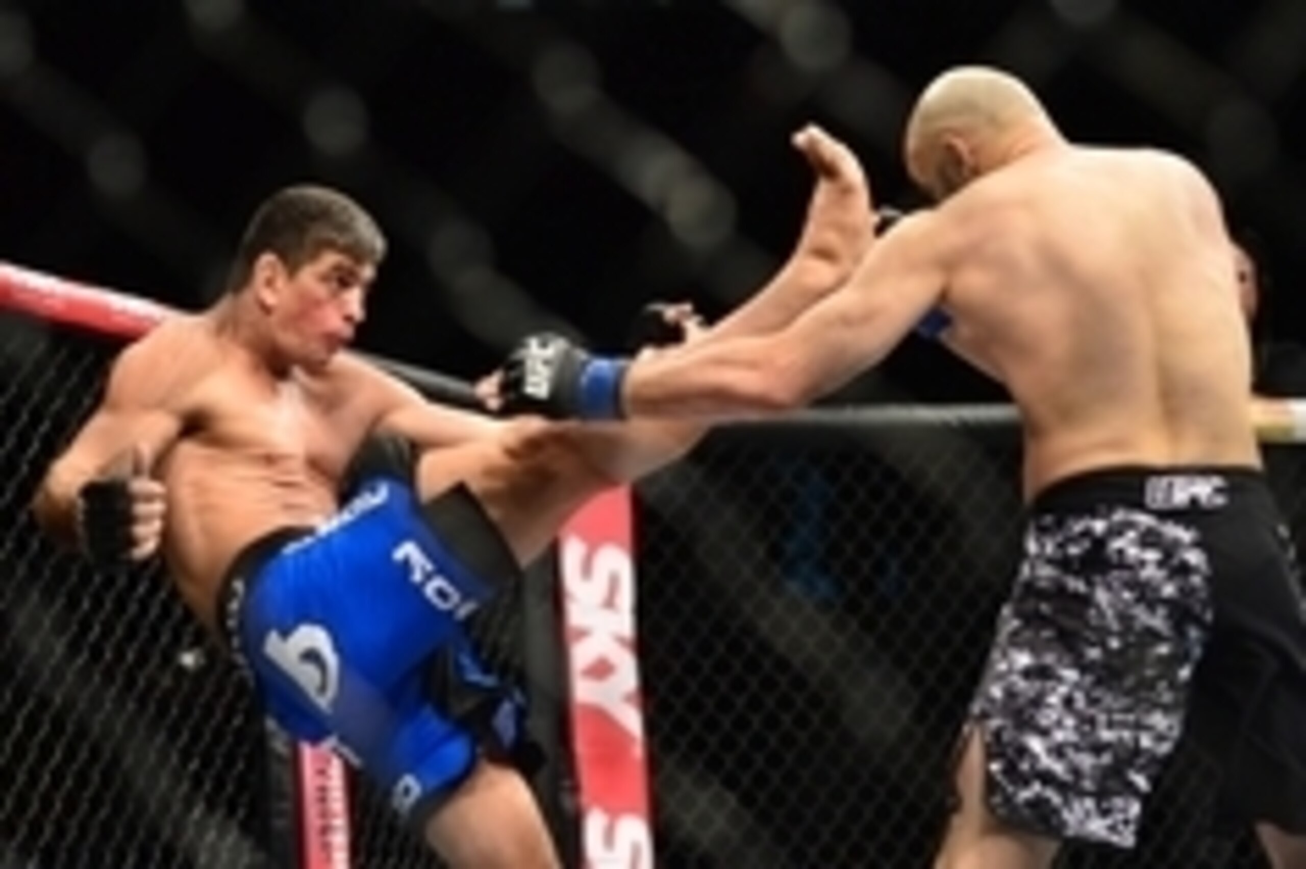 May 31, 2014; Sao Paulo, SP, BRAZIL; Paulo Thiago (red gloves) fights against Gasan Umalatov (blue gloves) during the TUF Brazil 3 Finale at Ibirapuera Gymnasium. Mandatory Credit: Jason Silva-USA TODAY Sports May 31, 2014; Sao Paulo, SP, BRAZIL; Paulo Thiago (red gloves) fights against Gasan Umalatov (blue gloves) during the TUF Brazil 3 Finale at Ibirapuera Gymnasium. Mandatory Credit: Jason Silva-USA TODAY Sports