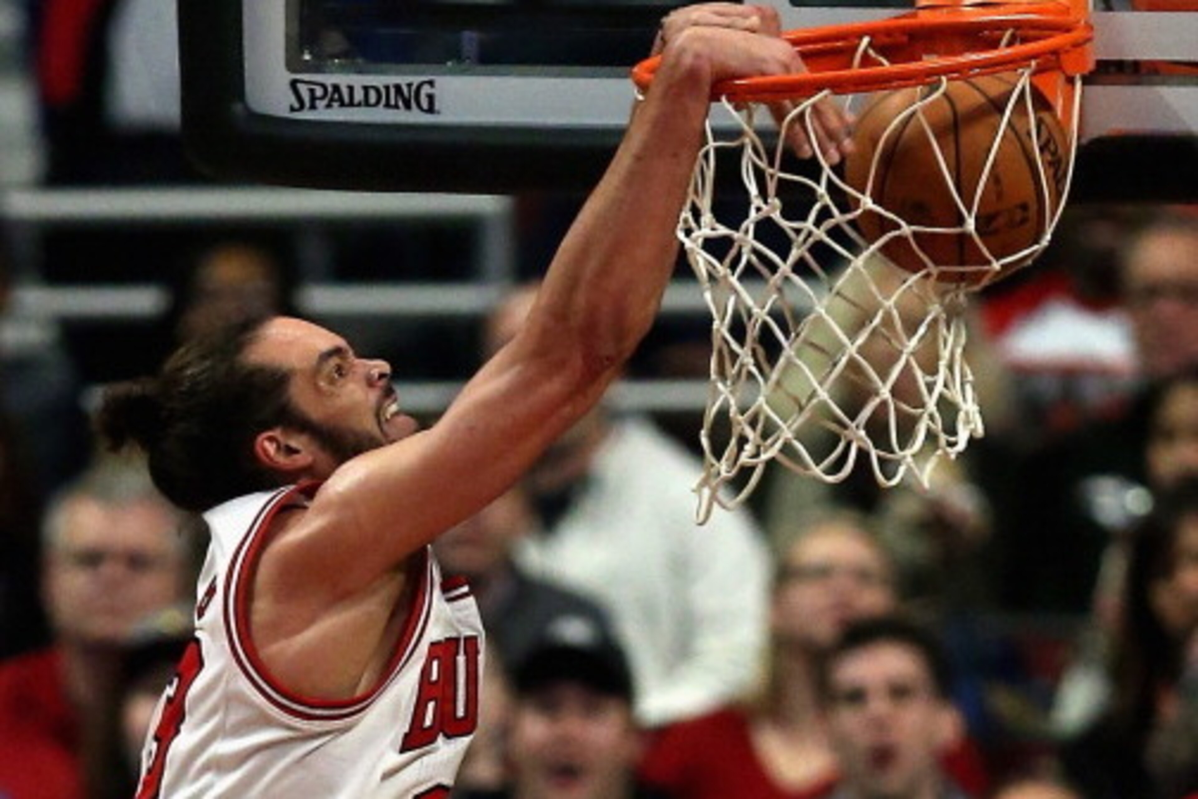 CHICAGO, IL - MARCH 15: Joakim Noah #13 of the Chicago Bulls dunks against the Sacramento Kings at the United Center on March 15, 2014 in Chicago, Illinois. The Bulls defeated the Kings 94-87. NOTE TO USER: User expressly acknowledges and agrees that, by 
