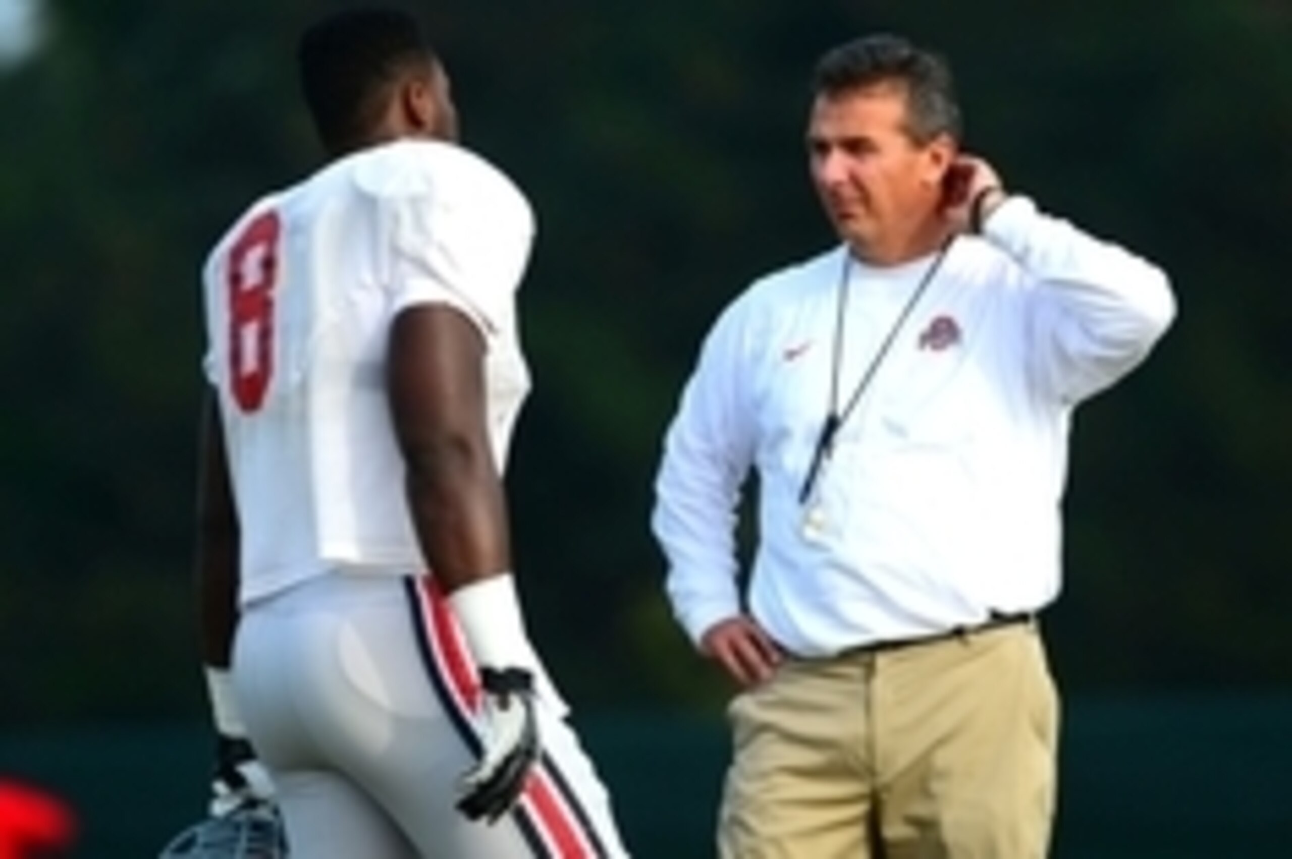 Aug 19, 2013; Columbus, OH, USA; Ohio State Buckeyes head coach Urban Meyer talks with Noah Spence (8) during practice at Ackerman Road Field. Mandatory Credit: Andrew Weber-USA TODAY Sports