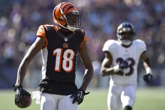 BALTIMORE, MD - SEPTEMBER 07: Wide receiver A.J. Green #18 of the Cincinnati Bengals rushes after making a catch to score in the fourth quarter against the Baltimore Ravens at M&T Bank Stadium on September 7, 2014 in Baltimore, Maryland. (Photo by Patrick
