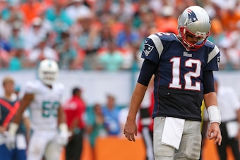 MIAMI GARDENS, FL - SEPTEMBER 07:  Tom Brady #12 of the New England Patriots looks on during a game against the Miami Dolphins at Sun Life Stadium on September 7, 2014 in Miami Gardens, Florida.  (Photo by Mike Ehrmann/Getty Images)