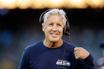 OAKLAND, CA - AUGUST 28:  Head coach Pete Carroll of the Seattle Seahawks walks along the sidelines during their game against the Oakland Raiders at O.co Coliseum on August 28, 2014 in Oakland, California.  (Photo by Ezra Shaw/Getty Images)