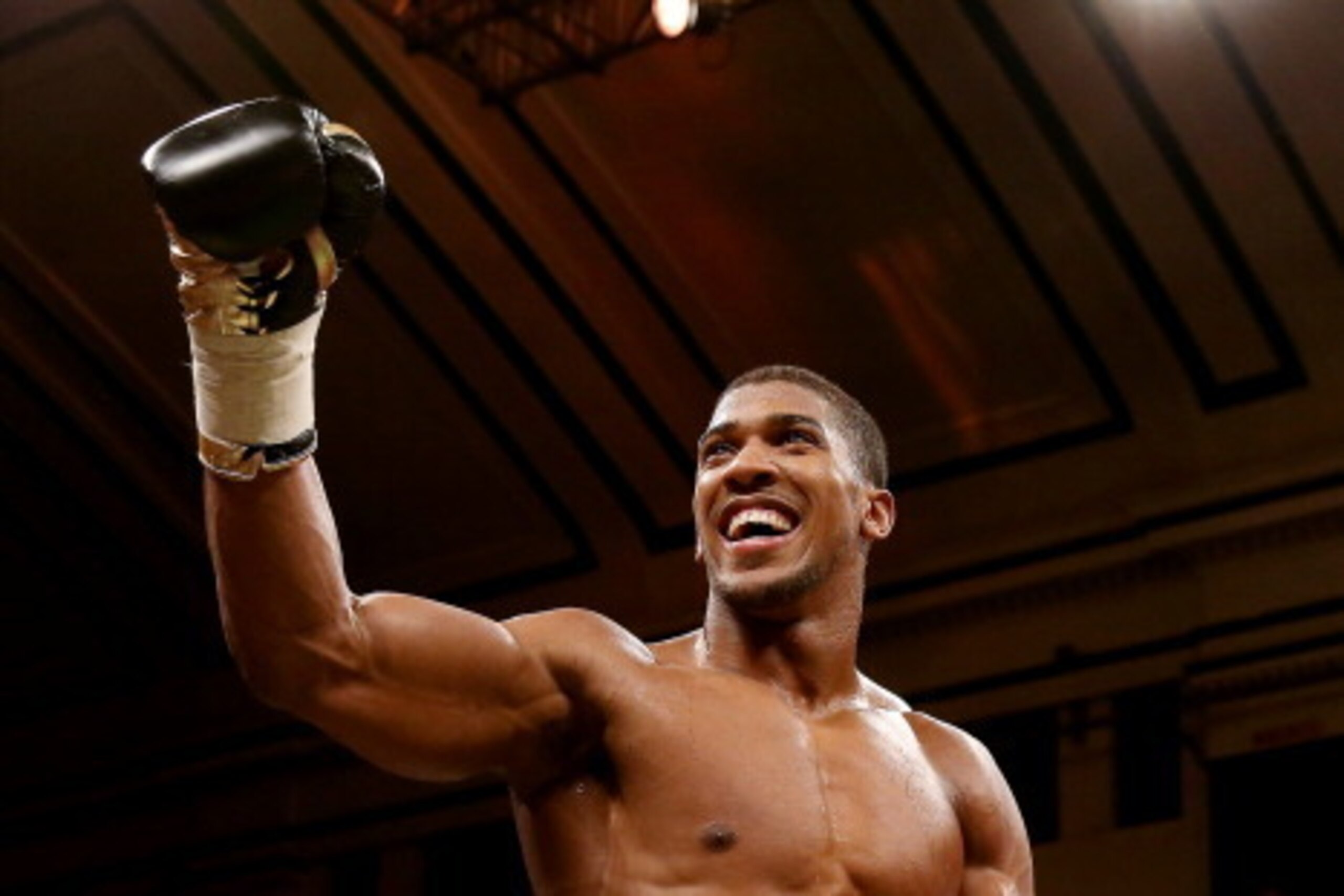 LONDON, ENGLAND - NOVEMBER 14:  Anthony Joshua celebrates his victory over Hrvoije Kisicek during their Heavyweight bout at York Hall on November 14, 2013 in London, England.  (Photo by Scott Heavey/Getty Images)