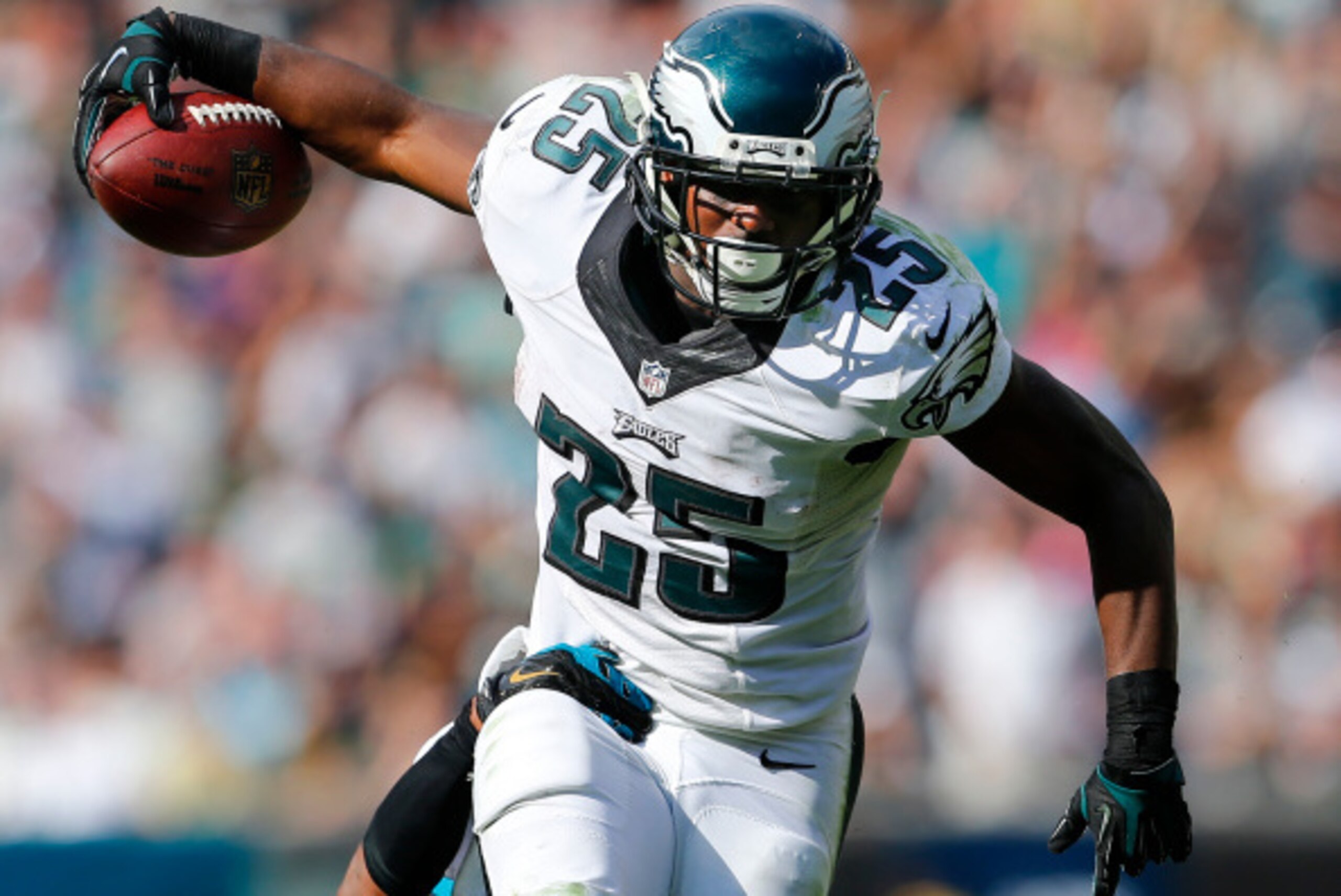 PHILADELPHIA, PA - SEPTEMBER 07:  LeSean McCoy #25 of the Philadelphia Eagles runs for a first down as Josh Evans #26 of the Jacksonville Jaguars attempts a tackle during the fourth quarter of a NFL game at Lincoln Financial Field on September 7, 2014 in 
