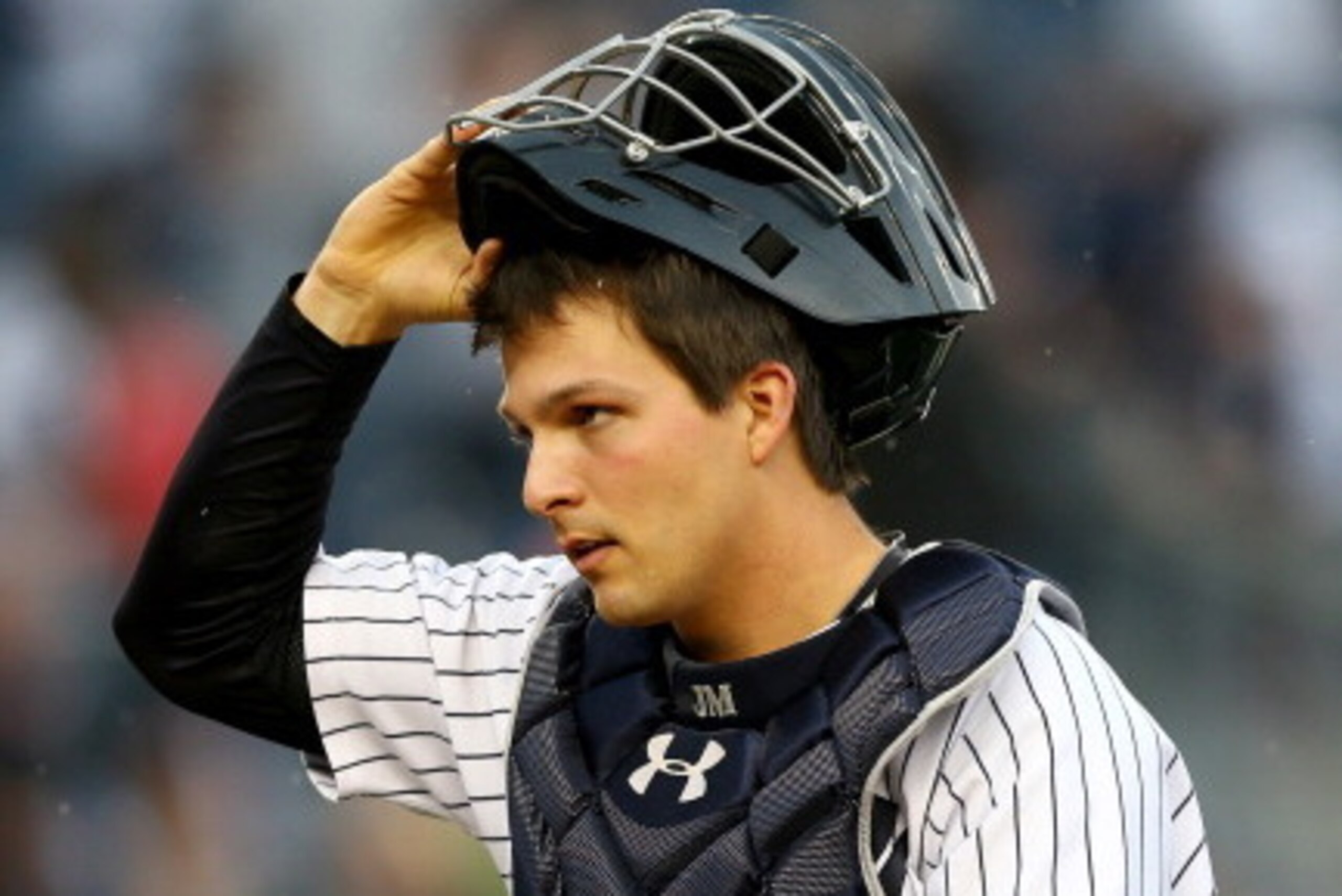 NEW YORK, NY - APRIL 26:  John Ryan Murphy #66 of the New York Yankees walks off the field after the win over the Los Angeles Angels of Anaheim on April 26, 2014 at Yankee Stadium in the Bronx borough of New York City.The New York Yankees defeated the Los