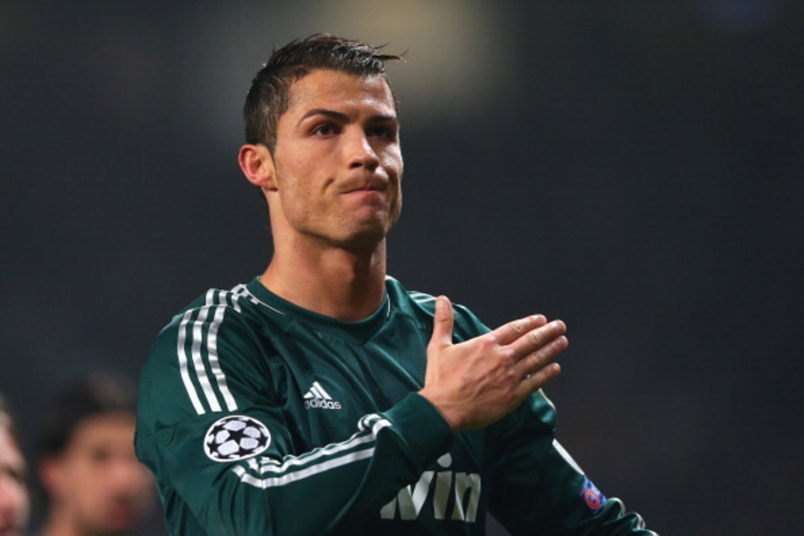 MANCHESTER, ENGLAND - MARCH 05:  Cristiano Ronaldo of Real Madrid salutes the crowd at the end of the UEFA Champions League Round of 16 Second leg match between Manchester United and Real Madrid at Old Trafford on March 5, 2013 in Manchester, United Kingd