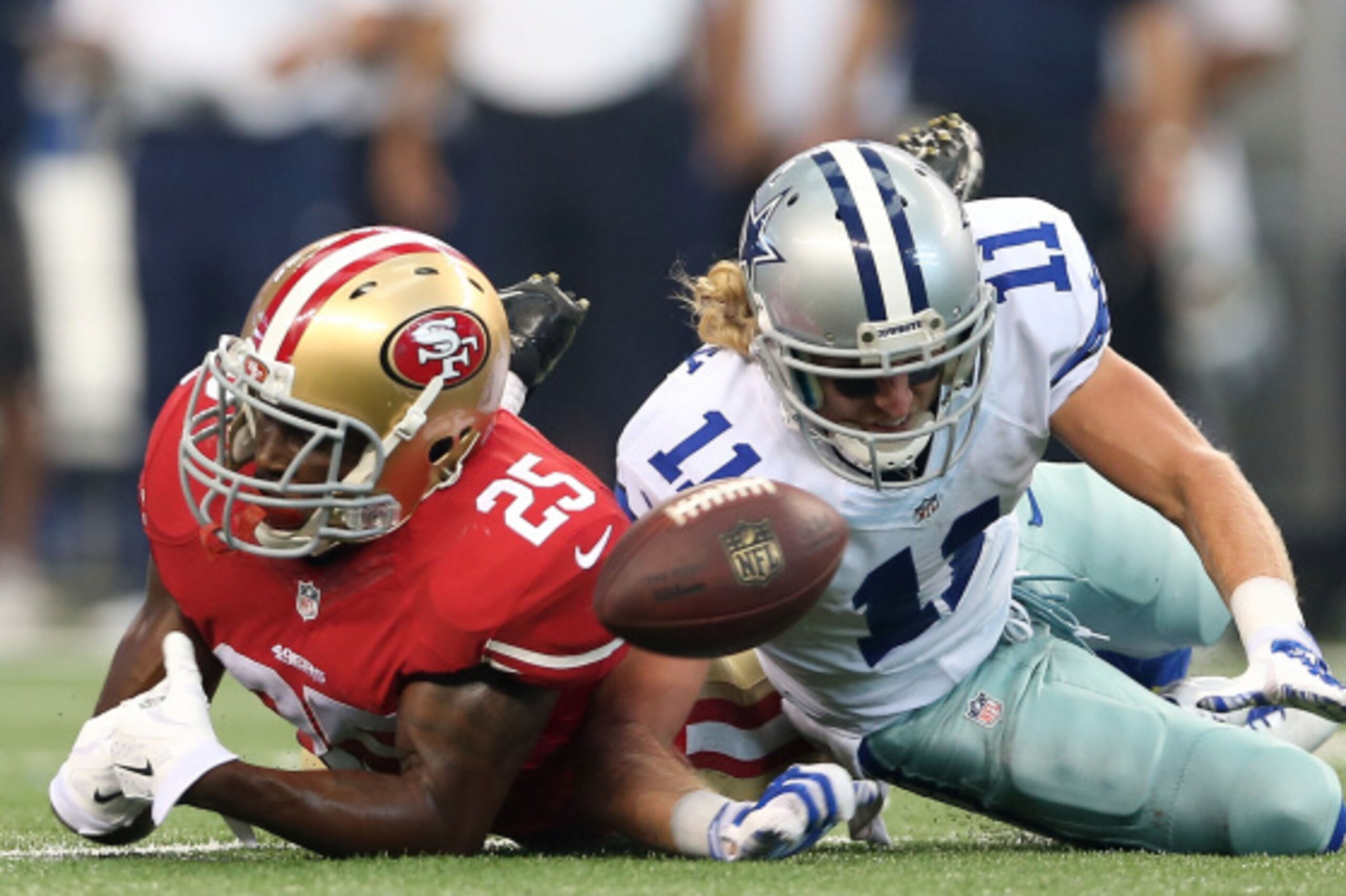 ARLINGTON, TX - SEPTEMBER 07:  Cole Beasley #11 of the Dallas Cowboys is unable to make the catch as he is defended by Jimmie Ward #25 of the San Francisco 49ers in the second half at AT&T Stadium on September 7, 2014 in Arlington, Texas.  (Photo by Chris